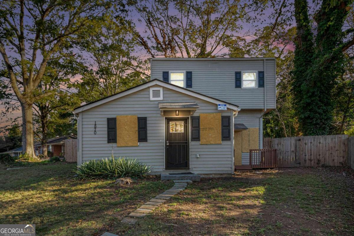 This inviting three-bedroom, two-bath, two-story home features a durable hardy exterior and a small back deck. The primary bedroom is conveniently located on the first floor, along with a laundry room and a small flex space. The kitchen boasts granite countertops and stainless steel appliances, all in good working condition (please note, there is no fridge). Upstairs, you'll find two additional bedrooms and a full bath. Laminate wood floors are featured in the kitchen and dining areas, while the rest of the home is carpeted, offering a blend of functionality and comfort.