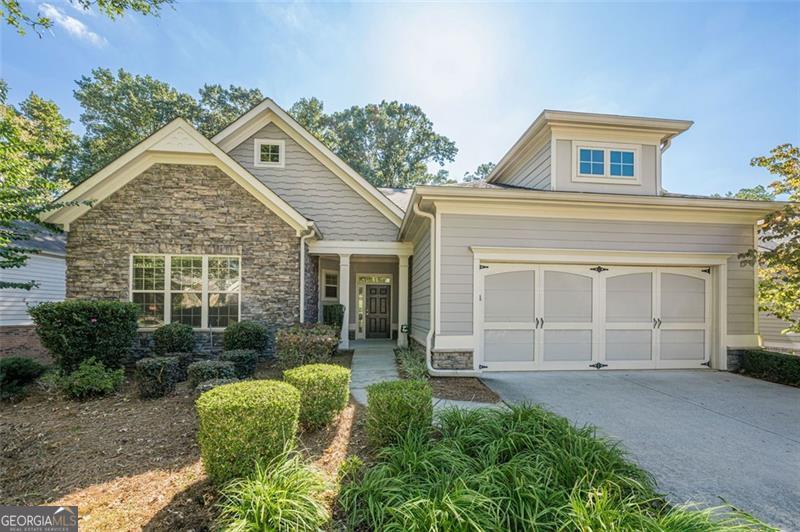Experience a home with much more than a finished terrace Level.....a home that boasts TWO separate and private residences under ONE roof! This home provides for the option for separate living quarters for generational living, aging parents, adult children, extended stay guests or a caregiver...while at the same time offering both privacy and proximity. This well-maintained ranch-style home enjoys an open and inviting floorplan. An oversized kitchen features abundant stained cabinetry with lots of pull-out drawers. Granite counters. Oversized island with bar seating. Stainless steel appliances. Refrigerator included. You will enjoy the open view and easy flow to the fireside great room and light-filled sunroom. The primary bedroom suite features two walk-in closets and a spacious bath. A secondary bedroom is tucked away at the front of the house, along with a full bath and a vaulted bonus room. The finished terrace level boasts nine foot ceilings, lots of windows and natural light. It was designed with the option for an additional independent living space in mind, with the inclusion of a second kitchen and a second laundry room. This is also an ideal space for gathering with family and friends, for watching football games and movies or playing pool. There is plenty of 'flex' space for hobbies, a home office, exercise room, and storage galore! Full kitchen with abundant cabinetry, granite counters, bar seating, refrigerator, range, microwave, dishwasher and pantry. Breakfast area. Spacious den. The two bedrooms are generous in size and have large closets. Full bath. Storage space. Two-car garage with a stepless entry into the home. Enjoy a wonderful Senior lifestyle in this highly sought-after Active Adult 55+ community! The Orchards of Brannon Oak Farm boasts a 'true sense of community'.....where neighbors get together, support each other, chat while on a morning walk and enjoy year-round social activities! The $250 / monthly HOA dues include lawn care and trash pick-up. The community clubhouse offers a great meeting space for various functions, a library, full kitchen and fitness center. Neighbors enjoy casual gatherings at the beautiful pool, as well as water aerobics in the summer. There is always something going on here.....!!! Canasta, Bridge, Poker, Bunco, Bingo, Mah-jongg, Book Club, Monthly Saturday Brunches, several themed get-togethers, Men's monthly Lunch, Ladies monthly Lunch, lots of walkers in the morning...... and so much more!!! The community boasts a terrific South Forsyth location nearby all the everyday conveniences, as well as nearby Northside Hospital, Emory Hospital and medical offices. Forsyth County boasts low property taxes and a great Senior tax exemption! There is a LOT to LOVE about this home and living at The Orchards of Brannon Oak Farm!!!