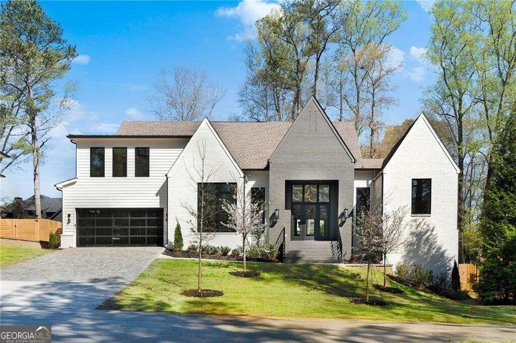 Step into this exquisite residence nestled in the charming neighborhood of Alpharetta WALKING distance to everything Downtown Alpharetta has to offer. This newly constructed gem seamlessly combines modern luxury with coastal charm, offering an unparalleled living experience. With 6 bedrooms, 4.5 bathrooms, and a spacious 3-car garage, this home epitomizes suburban elegance. Upon entry, you're greeted by a grand foyer adorned with tasteful accents and inviting details. The open-concept layout effortlessly connects the main living areas, allowing for a seamless flow from the living room to the dining area and gourmet kitchen. Sunlight streams in through large windows, highlighting the impeccable craftsmanship and attention to detail throughout. The kitchen is a chef's dream, featuring high-end stainless steel appliances, luxurious quartz countertops, and a stunning island centerpiece. The adjacent dining area provides an intimate setting for gatherings, while the living room exudes warmth and sophistication with its cozy fireplace and picturesque views of the backyard oasis. Retreat to the owner's suite, a sanctuary of tranquility boasting vaulted ceilings, elegant finishes, and a spa-like ensuite bathroom complete with a lavish soaking tub and walk-in shower. Step outside to discover your own private paradise, with a covered patio perfect for outdoor entertaining and a meticulously landscaped backyard offering a serene escape from the hustle and bustle of everyday life. Conveniently located in the heart of Downtown Alpharetta + Avalon, this home offers easy access to a wealth of upscale shopping, dining, and entertainment options, ensuring a lifestyle of luxury and refinement. !! APPROVED POOL PERMIT IN HAND!!