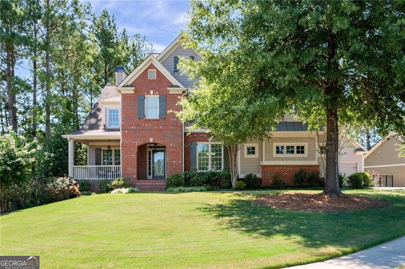 Welcome to 216 Brisbane Drive, a timeless Jeremy Rutenberg home in the heart of Bentwater, one of the most desirable master-planned communities in Acworth, Georgia. Known for its quality craftsmanship and enduring design, this residence combines elegance, comfort, and modern updates in a setting that is part of the highly rated North Paulding School District. From the moment you step inside, you'll appreciate the freshly painted interiors, gleaming hardwood floors, and a thoughtful layout that blends timeless style with everyday livability. The main level offers a versatile bedroom and full bath, perfect for guests, in-laws, or multigenerational living, while the heart of the home is the renovated kitchen featuring stainless steel appliances, classic cabinetry, and a seamless connection to the open living and dining areas. Upstairs, spacious bedrooms provide privacy and comfort, while the finished basement, completed by the builder, expands the home's possibilities with flexible spaces that include a private home gym, recreation areas, media room, or office retreat. The unfinished area would make a perfect future bedroom. Outdoors, a covered deck invites year-round gatherings while overlooking the private, wooded, and fully fenced backyard-ideal for entertaining, pets, gardening, or simply relaxing in peace. A rare three-car garage provides abundant space for vehicles, storage, or workshop needs, and the home's solid construction reflects the quality and timeless appeal that Jeremy Rutenberg homes are known for. Living in Bentwater offers more than just a beautiful house-it provides a resort-style lifestyle with access to multiple swimming pools, tennis courts, playgrounds, a championship golf course, and miles of scenic walking trails. Conveniently located near Acworth, Dallas, and Cartersville, and just a short drive to Lake Allatoona, this home offers the perfect balance of community, comfort, and convenience. If you're searching for a luxury home for sale in Acworth GA, look no further than 216 Brisbane Drive, where timeless design and modern upgrades come together in one of North Paulding's most sought-after neighborhoods.