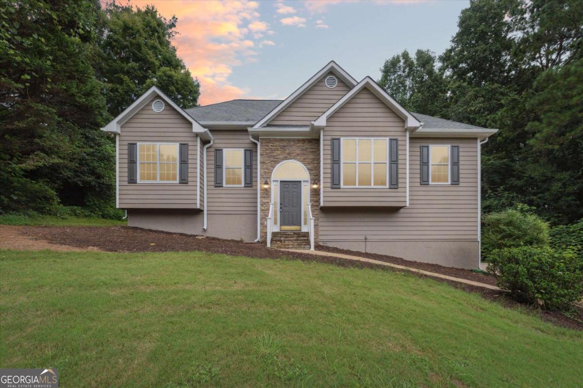 Fantastic rental opportunity in the highly sought after area Cumming! This classic, split level home features 4 bedrooms, 3 full baths, and bonus space! The main level features a spacious family room with great windows, high ceilings, and a cozy stone fireplace. Move into the kitchen where you will find loads of counter and cabinet space along with wood cabinets, updated flooring, tile backsplash, and a pantry. Enjoy a casual dining space just off the kitchen. Refrigerator is included with the lease, as well as the dishwasher and stove. Enjoy a flex room with double doors, perfect for a formal dining room or home office. Continue to the oversized master bedroom with double trey ceiling, ceiling fan, a huge walk in closet, and en suite bath. The master bath offers a modern soaking tub, separate shower, double sinks, and updated fixtures. The additional two bedrooms are a great size, have walk in closets, and share the second full bathroom with a shower/tub combo. Head down to the finished basement where you will find a bonus room perfect for a secondary seating area, game room, or media space. The fourth bedroom and another full bath are found on the lower level making this a great place for guests or a teen suite. The lower level has walk out access to the covered back patio space and backyard, with easy access to the side entry garage and driveway. You will love the easy to maintain landscaping of this cul de sac lot, with simple shrubbery and a nice sized lawn. Enjoy multiple outdoor living spaces including a large open air deck as well as a screened & covered back porch where you can relax or entertain no matter the season! This home is conveniently located in the North Forsyth area and is near local shopping and restaurants. Updates Include: Exterior paint, screened in deck updated and painted, new garage door, new landscaping, updated LVP in the master, new soaking tub in master bath, interior paint recently updated, carpet recently replaced. Truly a must see opportunity!