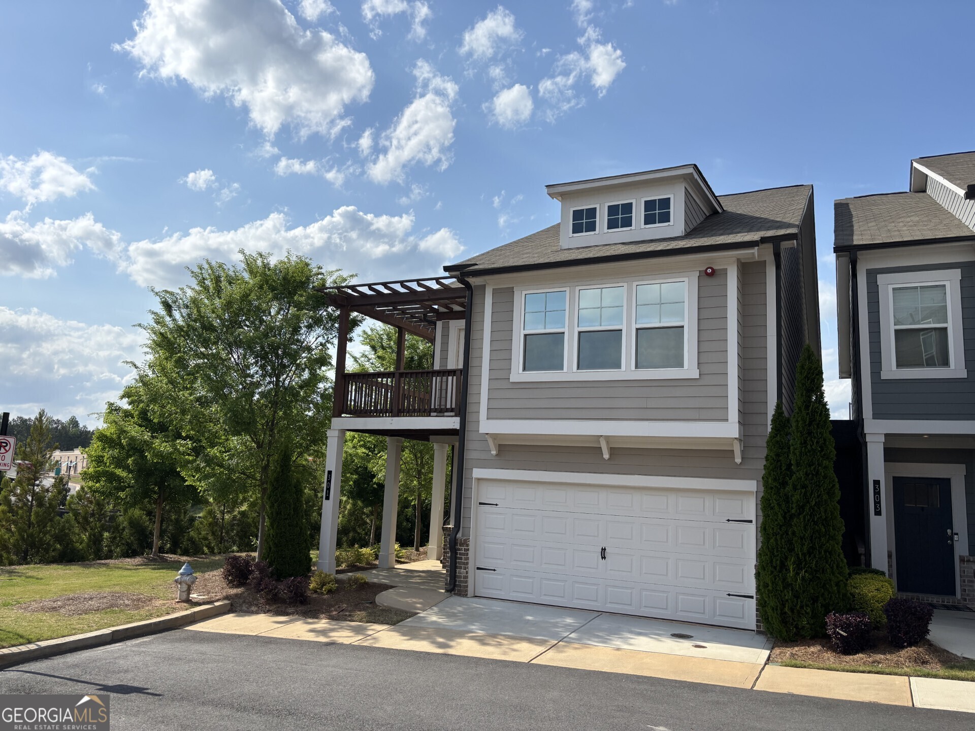 Beautiful, END UNIT, MODEL HOME with WRAP-AROUND BALCONY off the front Bedroom. SEMI DETACHED DESIGN for noise reduction. This 3 bedroom, 2.5 bathroom design was the TOP SELLING PLAN and Model Home during the initial construction of the Community. Open Kitchen to the Family Room, with an oversized island, QUARTZ COUNTERTOPS. 5-BURNER GAS RANGE and Whirlpool Gold refrigerator. LARGE MASTER BEDROOM, Trey ceiling and large walk-in closet. Master Bath with soaking tub, separate shower and beautiful floor tiles. Hardwood floors throughout the main level and upper hallway, solid oak stair treads and built in shelving around the fireplace. ADDISON POINT is a well maintained community, close to shopping, entertainment, restaurants and perfectly situated along major travel arteries. Minutes from Historic/Downtown Woodstock, Lake Allatoona, Kennesaw State University, Kennesaw Mountain, an abundance of Parks, hiking trails and much more...Schedule a visit to view the property and the surrounding area - BEAUTIFUL COMMUNITY AND GREAT LOCATION...