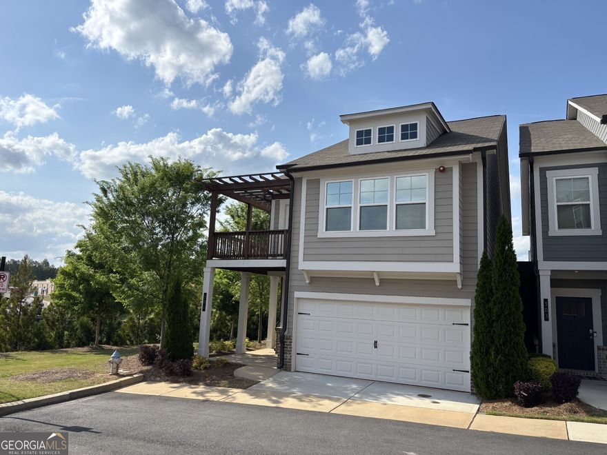 Beautiful, END UNIT, MODEL HOME with WRAP-AROUND BALCONY off the front Bedroom. SEMI DETACHED DESIGN for noise reduction. This 3 bedroom, 2.5 bathroom design was the TOP SELLING PLAN and Model Home during the initial construction of the Community. Open Kitchen to the Family Room, with an oversized island, QUARTZ COUNTERTOPS. 5-BURNER GAS RANGE and Whirlpool Gold refrigerator. LARGE MASTER BEDROOM, Trey ceiling and large walk-in closet. Master Bath with soaking tub, separate shower and beautiful floor tiles. Hardwood floors throughout the main level and upper hallway, solid oak stair treads and built in shelving around the fireplace. ADDISON POINT is a well maintained community, close to shopping, entertainment, restaurants and perfectly situated along major travel arteries. Minutes from Historic/Downtown Woodstock, Lake Allatoona, Kennesaw State University, Kennesaw Mountain, an abundance of Parks, hiking trails and much more...Schedule a visit to view the property and the surrounding area - BEAUTIFUL COMMUNITY AND GREAT LOCATION...