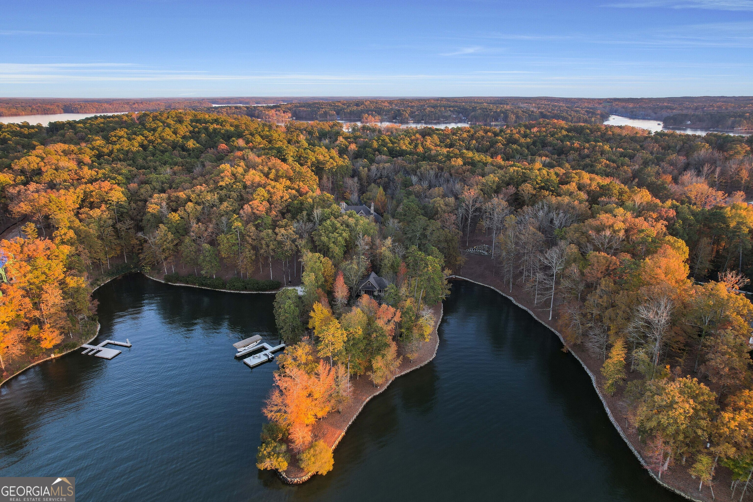 Discover an extraordinary opportunity to create your dream lakefront retreat on this 5.42-acre homestead estate size lot within the prestigious gates of Reynolds Lake Oconee. Perfectly positioned with a large, level build site, this one-of-a-kind property offers exceptional privacy and panoramic views across the main lake all the way to Great Waters Golf Course. Imagine a main-level walkout from your custom home leading to a stunning outdoor entertainment area, complete with an infinity-edge pool that seems to flow directly into the shimmering waters of Lake Oconee. Whether you envision a modern masterpiece or a timeless lakefront lodge, this homesite is a blank canvas for your architectural vision. With ample space for an additional guest house, the possibilities are truly endless-ideal for multi-generational living or hosting family and friends in style. A golf membership is available, granting you access to the world-class amenities of Reynolds Lake Oconee, including championship golf, lakefront dining, tennis, fitness, miles of trails, and more. This is more than a homesite-it's a legacy opportunity to build a private estate that embraces luxury, leisure, and lifestyle on Georgia's most iconic lake.