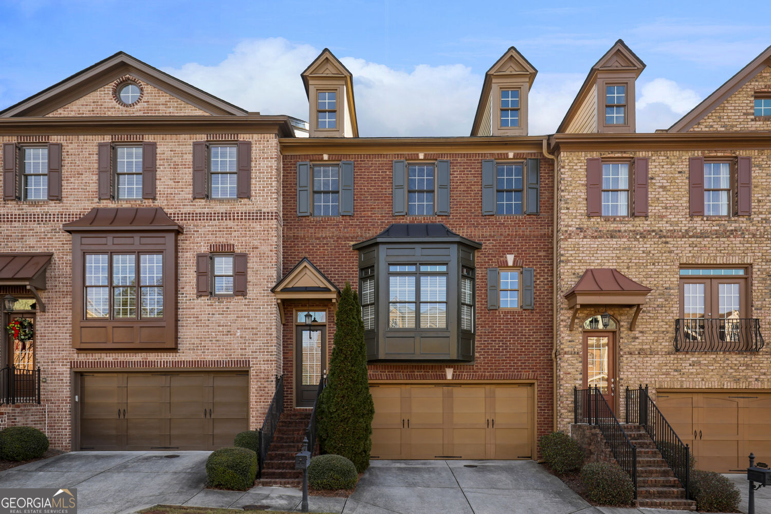 Elegant Executive Townhome in Prestigious North Fulton - Private Setting, Top-Tier Schools, and Exceptional Amenities. Investors welcome! Discover the perfect blend of luxury, space, and functionality in this beautifully appointed executive-style townhome, quietly situated in a private cul-de-sac within one of North Fulton's most desirable locations. Surrounded by mature trees and manicured landscapes, this residence offers the peace and privacy of a single-family home with the convenience of townhome living. Zoned for top-rated North Fulton public schools and within easy reach of shopping, dining, and major highways: GA400, Peachtree Pkwy / 141, Avalon, Halcyon, Whole Foods Market, the new Johns Creek City Center. This home is ideal for professionals, families, and those seeking a refined lifestyle with minimal maintenance. Open Concept Living with Upscale Finishes: Step through the charming covered entry into a welcoming private 2-story foyer, framed with elegant wood and metal railings, setting the tone for the upscale features that follow. The main level features a bright and spacious open-concept design, perfect for modern living and entertaining. A formal dining area ideal for hosting dinner parties and holiday gatherings opens to a large living area with a cozy gas fireplace-the perfect place to relax with family or guests. Adjacent to a casual breakfast area that opens seamlessly onto a private rear deck, providing extended outdoor living space for morning coffee, weekend grilling, or evening relaxation. The kitchen in this townhome provides abundant cabinets, a pantry, gas range, microwave, oven, dishwasher, disposal, refrigerator and a convenient nook home office space with built-in cabinets and file drawers. granite countertops, tile backsplash and recessed lighting add to the upscale appearance. Upstairs, retreat to the oversized primary suite featuring a walk-in closet, spa-style bathroom with soaking tub, separate tiled shower, and dual vanities. Two additional spacious bedrooms share a full, well-appointed hall bathroom. The second-floor laundry room includes a washer and dryer for your convenience. The Lower-Level offers flexibility galore, with an enormous BONUS room that includes a spacious walk-in closet and a full-sized bathroom; media room, home office, playroom or overnight accommodations for Guests. A two-car attached garage also at this level enters into a mud room/drop zone before retreating to the Main level of the home.