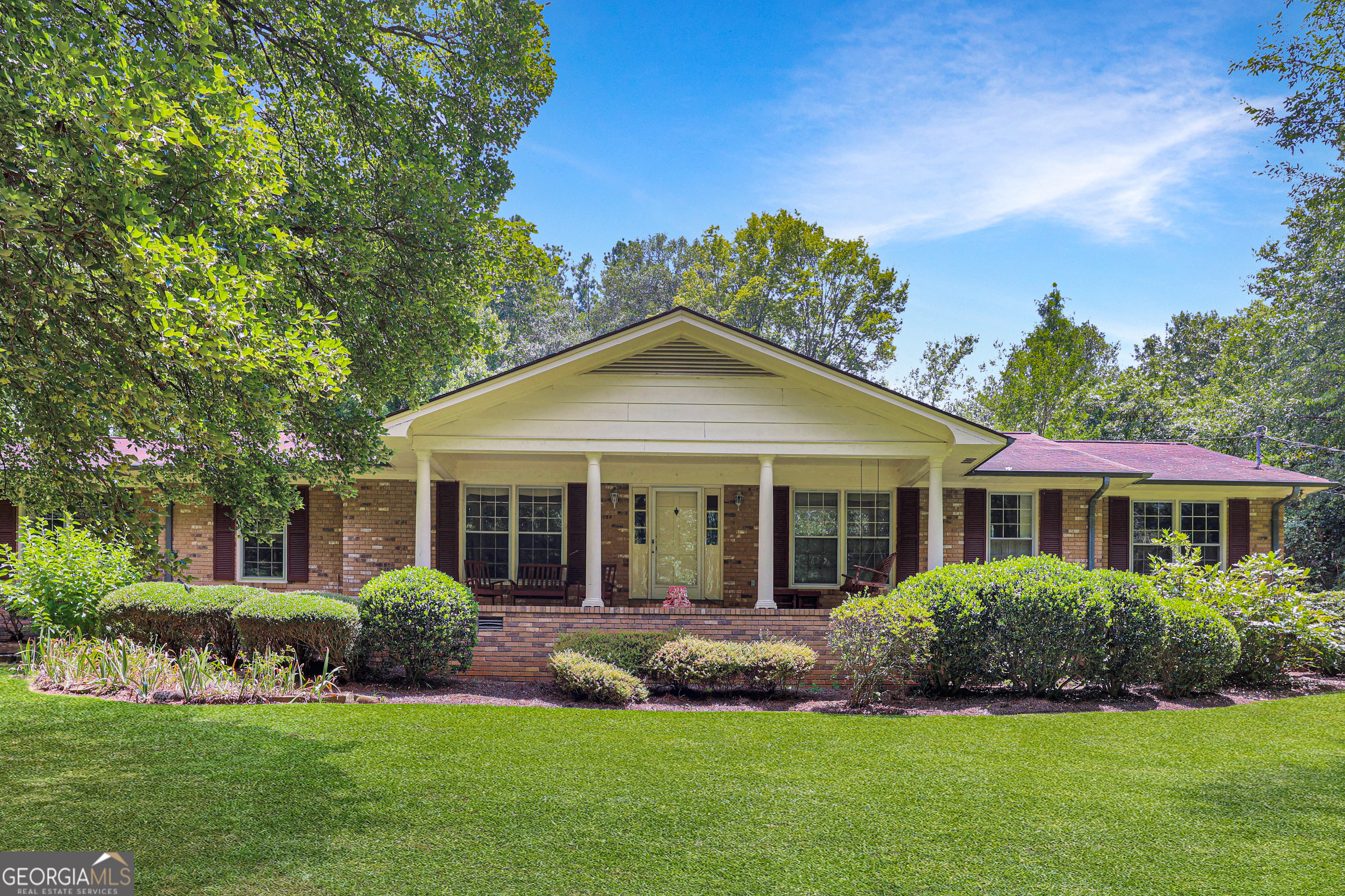 GET LOST while enjoying the PEACE and QUIET that comes with owning 4 acres in Athens GA. EASY living on the one-level ranch plan complete with four full bedrooms PLUS office/5th bedroom on the opposite side of the home. Office has a private entrance and full bath, making this a potential room rental or home office you can close off to the rest of the home. LARGE, cozy rooms make gathering fun and spacious. Enjoy the oversized formal living and dining room as well as the cozy den complete with brick fireplace and large completed sunroom open to the kitchen and den. Deck overlooks private backyard complete with PARTY DECK. EXPLORE your talents in the shed, perfect for developing a hobby, and a rustic chicken coop to start homesteading. Feel the love this home offers - the original owners have wonderful memories of time well spent together. Public Water is available at street, owner enjoyed the well water