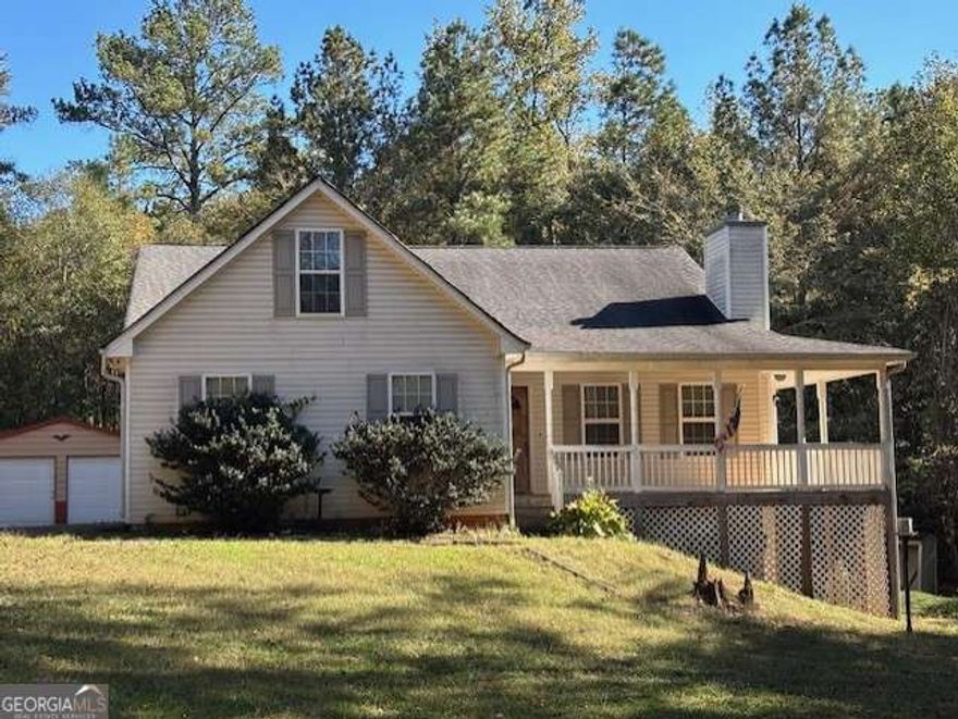 Opportunity knocks! This 3-bedroom, 2-bath home sits on a beautiful and private 5.25-acre lot, offering peace, quiet, and loads of potential. Nestled in a tranquil setting, this property is perfect for investors or buyers looking to customize their dream home with a bit of TLC.    The home features an unfinished basement with tons of potential for added living space, a workshop, or a recreation area. Enjoy the benefits of country living with a private driveway that leads to your new home.    Out back, you'll find a spacious 2-door garage/storage unit, ideal for storing tools, equipment, or converting into a workshop or hobby space.    Whether you're looking to renovate, rent, or create your forever home, this is a rare opportunity to own acreage in a desirable part of McDonough with room to grow and personalize.    Don't miss your chance to invest in potential - schedule your showing today!