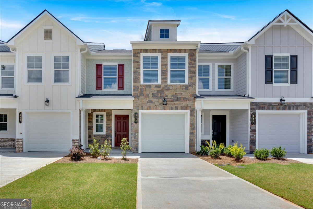Move-in ready and full of charm, the Crape Myrtle at Village Green is a well-designed 3-bedroom, 2.5-bath new construction townhome. The open-concept main level features an LVP flooring, a stylish kitchen with granite countertops, tile backsplash, and a spacious island with overhang-perfect for entertaining or everyday living. The open-concept family room features an electric fireplace. All kitchen appliances are included for added convenience. Upstairs, the private primary suite offers a spa-like bathroom with double vanities, and 2 walk-in closets. Located in Adairsville with easy access to I-75, Village Green offers affordable, low-maintenance living with builder warranties and 100% USDA financing options available. Listed at only $265,900 with $7,000 of the $12,000 builder incentive already applied to the price ! The remaining $5,000 can be used any way you choose- whether its toward closing costs, a rate buydown, or even to reduce the price further. Ask about our preferred lender and flexible options.