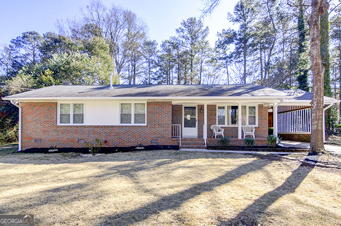 Won't last! Welcome home to this Charming 3-bedroom, 2-bath four-sided-brick ranch, perfect for comfortable living and entertaining! This inviting residence features a spacious living room, a well-appointed kitchen, and a separate dining area for cozy meals. The primary suite includes a private bath and generous closet space, with two additional bedrooms ideal for family, guests, or a home office. Relax in the bright, airy sunroom, ideal for relaxing year-round with views of the lush backyard. Outside, enjoy your own private oasis with a sparkling in-ground pool, perfect for summer gatherings or quiet evenings. Situated on a well-maintained lot with mature landscaping, this home blends functionality with leisure and is within walking distance to a variety of great amenities in Fayetteville.