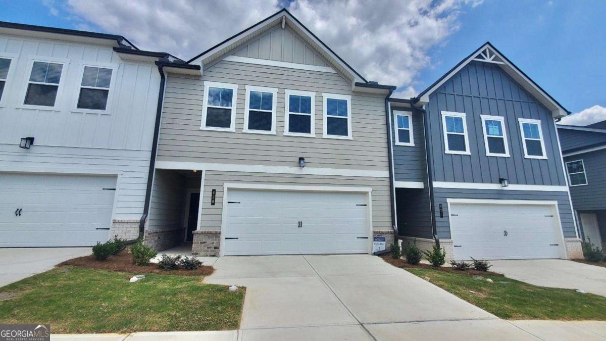 Welcome to Logan Point by Century Communities in beautiful Loganville, where peaceful living meets modern design in this charming Aster floorplan featuring an open layout, a stylish kitchen with white cabinets, granite countertops, a large island, and walk-in pantry, flowing into a cozy great room with a lovely electric fireplace; enjoy luxury vinyl plank flooring throughout the main areas, a spacious primary suite with double vanities, a walk-in shower, separate soaking tub, and walk-in closet, plus an upstairs loft, oversized laundry room, and well-sized bedrooms - all in a friendly community with a 2-car garage, patio, and easy access to everything you need.