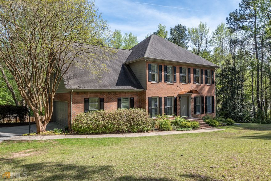 Welcome to 113 East Creek Bend. This stately renovated 4 BR 2.5 BA brick home offers light and bright rooms with warm hardwood floors throughout the first level. Formal Living and dining rooms connected by inviting foyer and staircase leading to the second level. Stylish updated half bath. Large, comfortable family room with fireplace adjacent to updated well appointed kitchen with custom cabinetry, solid surface counters, contemporary subway tile and an abundance of entertaining spaces including a large center island. Cheery breakfast nook, dedicated laundry room, walk-in pantry and utilitarian two-car garage access beyond. Kitchen back door leads to spacious and private deck with yard access. Upstairs there is a generous owner's suite with large spa-like bathroom with two sinks, soaking tub as well as a large walk-in shower. There are two additional bedrooms with a dedicated bathroom as well as a larger flex room that can serve as a media room, play room or fourth bedroom. Ample storage and closet spaces on this floor including two walk-in closets in primary and secondary bedrooms. This home sits on .96 acres of private, tranquil land and is partially fenced. There is an outbuilding for gardening storage as well as a playscape for fun. Conveniently located just minutes from Barnett Shoals shopping and restaurants, The University of Georgia and downtown Athens.