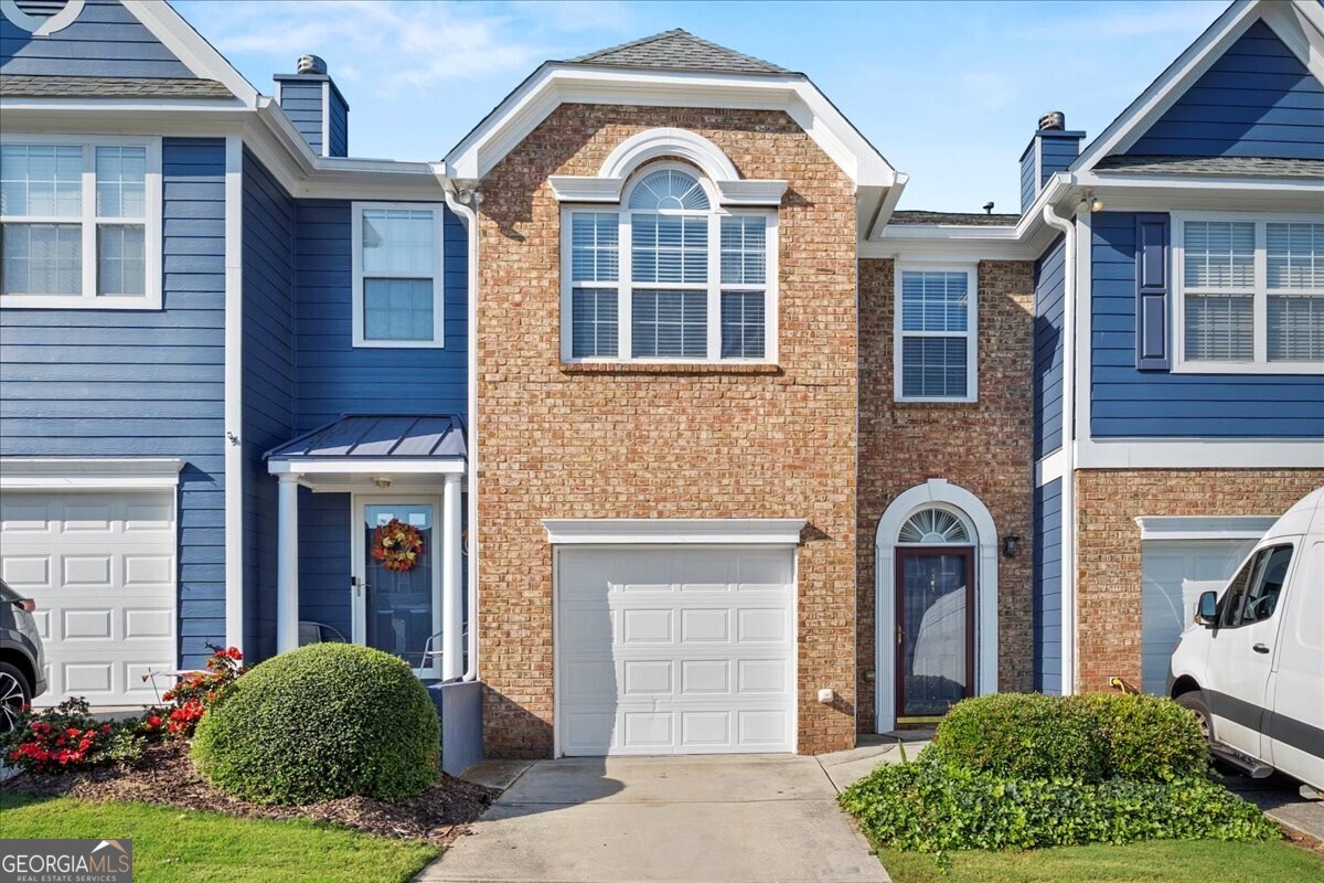 Welcome home to this 3-bedroom, 2.5-bath townhome in the sought-after Tide Water Cove Subdivision, Downtown Flowery Branch. Enjoy new flooring throughout, fresh paint, updated lighting, new water heater, and a fairly new HVAC. Natural light fills the home, which features a cozy fireplace, stainless steel appliances, an open floor plan, and a rear patio ideal for entertaining. The spacious primary suite offers a vaulted ceiling, walk-in closet, separate tub and shower, and double vanity. Additional bedrooms and laundry are conveniently on the same level. There's plenty of room for family, guests, or a home office. This home is walking distance to Fishtales Restaurant and Hideaway Bay Marina. With no rental restrictions and a competitive price, it will not last long.