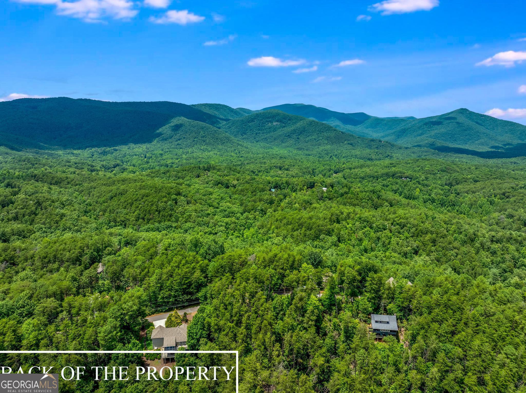 MOUNTAIN VIEW property featuring sunrise AND sunset views! Bring your builder to CREATE YOUR DREAM home for you. A one-acre lot has JUST become available in the sanctuary of SKYLAKE! Enjoy your morning coffee on the back porch while SURROUNDING yourself with peace. EMBRACE this glamping lifestyle in Skylake utilizing the many trails throughout the neighborhood, fishing in the lake, or playing PICKLEBALL or TENNIS by the POOL. Relax with your friends while enjoying a glass of wine by the WATERFALL PARK, playing a game of cards at the Clubhouse, or the scheduled MUSIC by the lake events. In Skylake be involved as little or as much as you like! The neighborhood is designed for privacy in nature with all the socialization of your choice in your grasp! HELEN, Mount Yonah, and many WINERIES are just a stone's throw away from your doorstep!