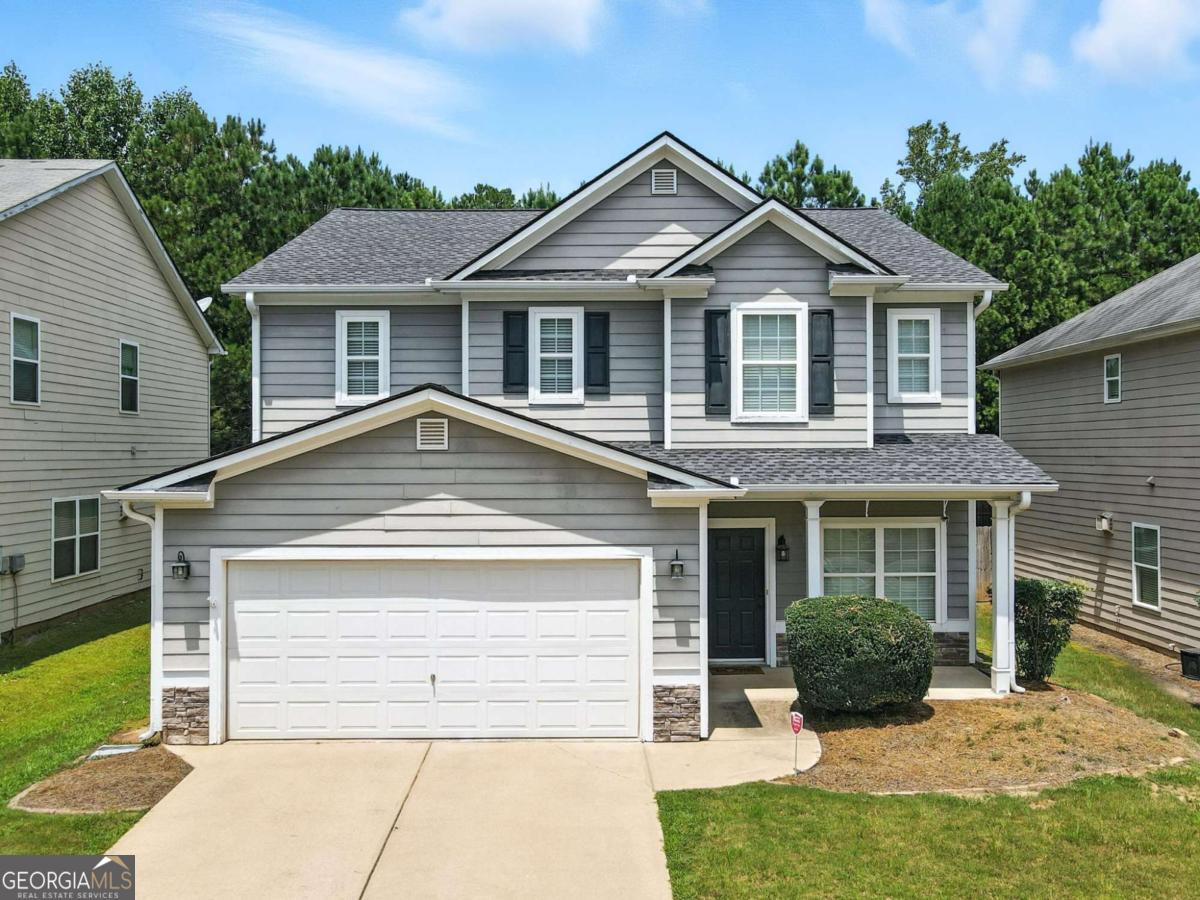 Welcome to 301 Parkmont Way in The Park at Cedarcrest! This charming and spacious home is tucked at the end of a quiet cul-de-sac, offering extra privacy and minimal traffic. Inside, you'll find a bright, open-concept main level-perfect for both everyday living and entertaining. The kitchen includes all appliances (including a brand-new refrigerator in 2025!) and flows seamlessly into the dining and living areas. Upstairs features three generously sized bedrooms, including a large primary suite, along with two full bathrooms and a convenient half bath on the main floor. The home also boasts a newer roof installed in 2020 and a fully fenced backyard-ideal for kids, pets, or outdoor relaxation. Step outside onto the oversized back patio and enjoy the extra space for grilling, dining, or lounging. A two-car garage adds plenty of storage and parking. This well-maintained home is just minutes from shopping, dining, and local amenities. Don't miss your chance to own this move-in ready gem in a sought-after community!