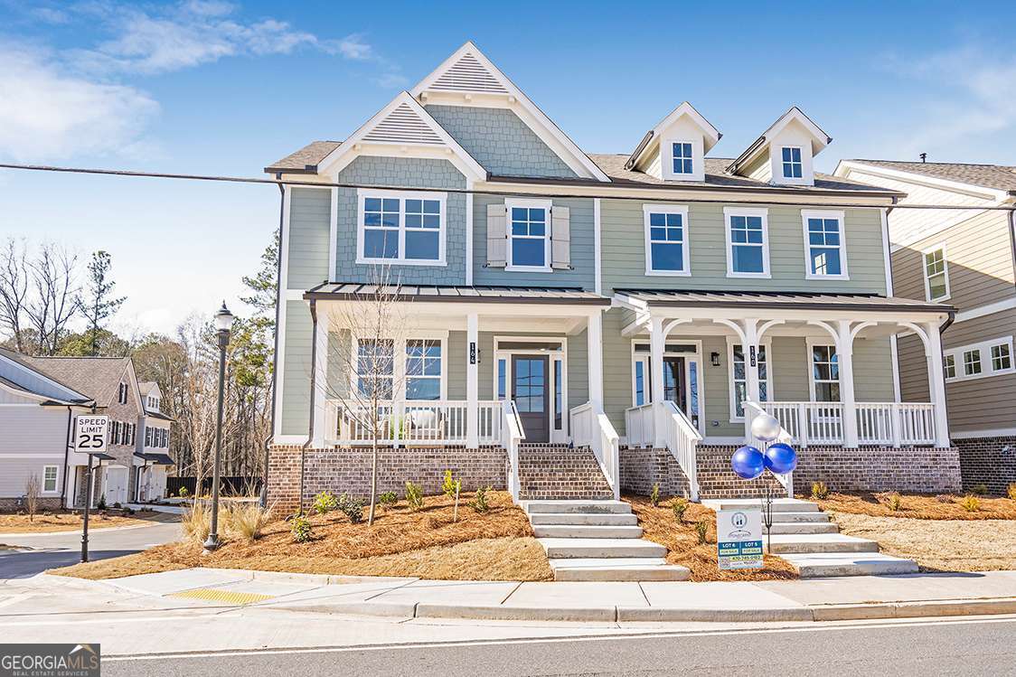 Come home to the heart of it all in one of Cherokee's most dynamic new addresses at the new Holly Springs Town Center with walkable access to Town Center's restaurants, retail stores, green spaces, events and a new outdoor amphitheater. Centered on the landmark new Holly Springs City Hall, the heart of Holly Springs Town Center will be an inviting community space set to play host to festivals, markets and community events like the city's annual Autumn Fest, monthly concerts, food truck nights, morning farmers markets, Christmas Parade and more. The NEW Holly Floor Plan by Stonecrest Homes serves as our model home and is now available for purchase.. This townhome residence offers the best in lock and go living with 4 bedrooms, 3.5 bathrooms, over 2700 sq ft across three levels. Family room with fireplace overlook covered brick front porch. Stunning Kitchen with center island and walk in pantry walk out to rear covered porch. Generous primary suite with spa bath. Two secondary bedrooms up share a gracious hall bath. Flex room on lower level with walk in closet and full bath with shower stall serves as rec space or guest suite. Additional unfinished room on the lower level can easily convert to an exercise or work from home space. Two car rear entry garage with addt'l storage. Perfect floorplan for today's ACTIVE lifestyle. Walk to the new HOLLY SPRINGS TOWN CENTER! Enjoy Food Truck Alley on the 3rd Thursday of every month and Holly Springs Harmonies Concert night one Saturday of the month all summer held at the adjacent Historic Train Depot at the corner of Holly Springs Parkway & Hickory Rd. Don't miss this early opportunity to live in another Cherokee County TOWN CENTER like DT Woodstock or Canton before it goes vertical. Calling all who remember that real estate's most important factor is location, location, location!