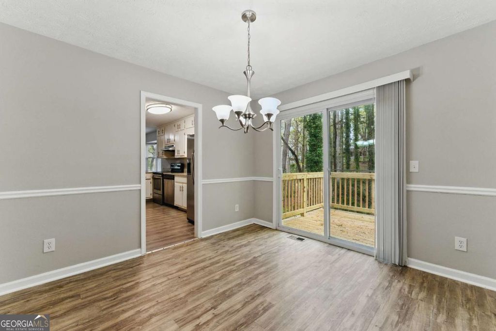 Photo of 4716 Alpine Drive SW, Lilburn, GA 30047 (MLS # 10673779)