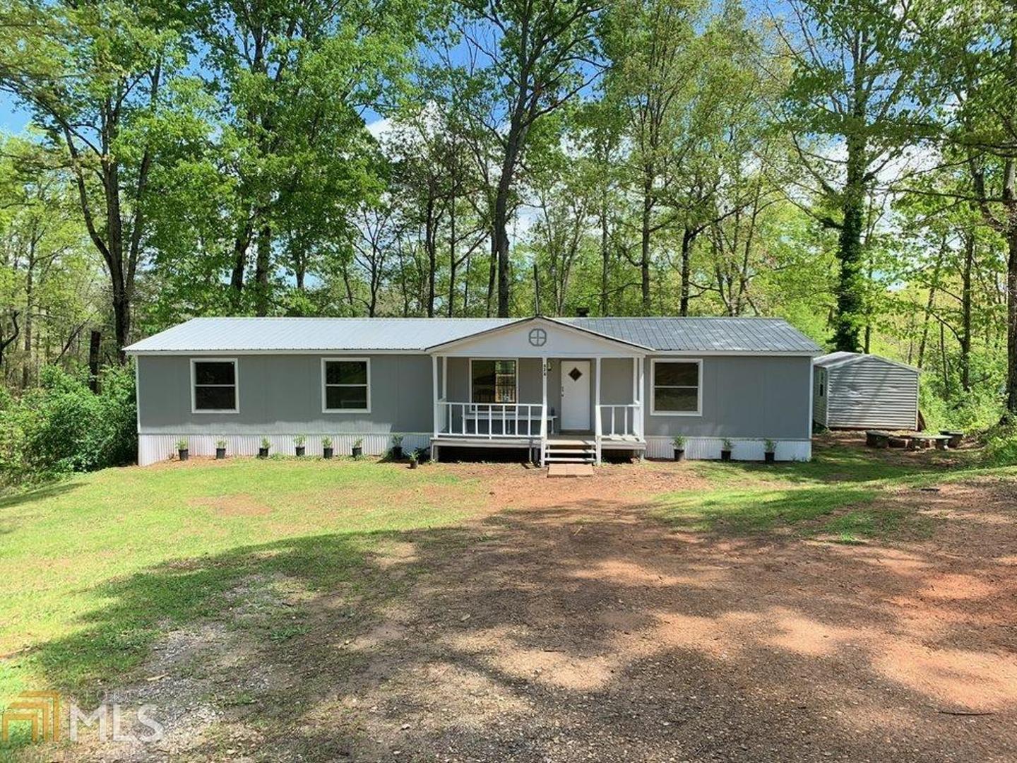 Recently renovated! 3 bedroom, 2 bathroom mobile home on a 1 acre lot! New paint and flooring throughout.