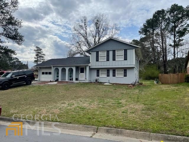 Well Kept home with lots of space and Master Bedroom on Lower with a Full Bath. Roof was installed less than 4 years ago. Part of the Kitchen with granite and modern backsplash. Open view from Living room and kitchen. Furnace installed less than 4 years ago. One car garage. Beautiful corner lot. Easy access to I-285. A lovely home you will want to call your own.