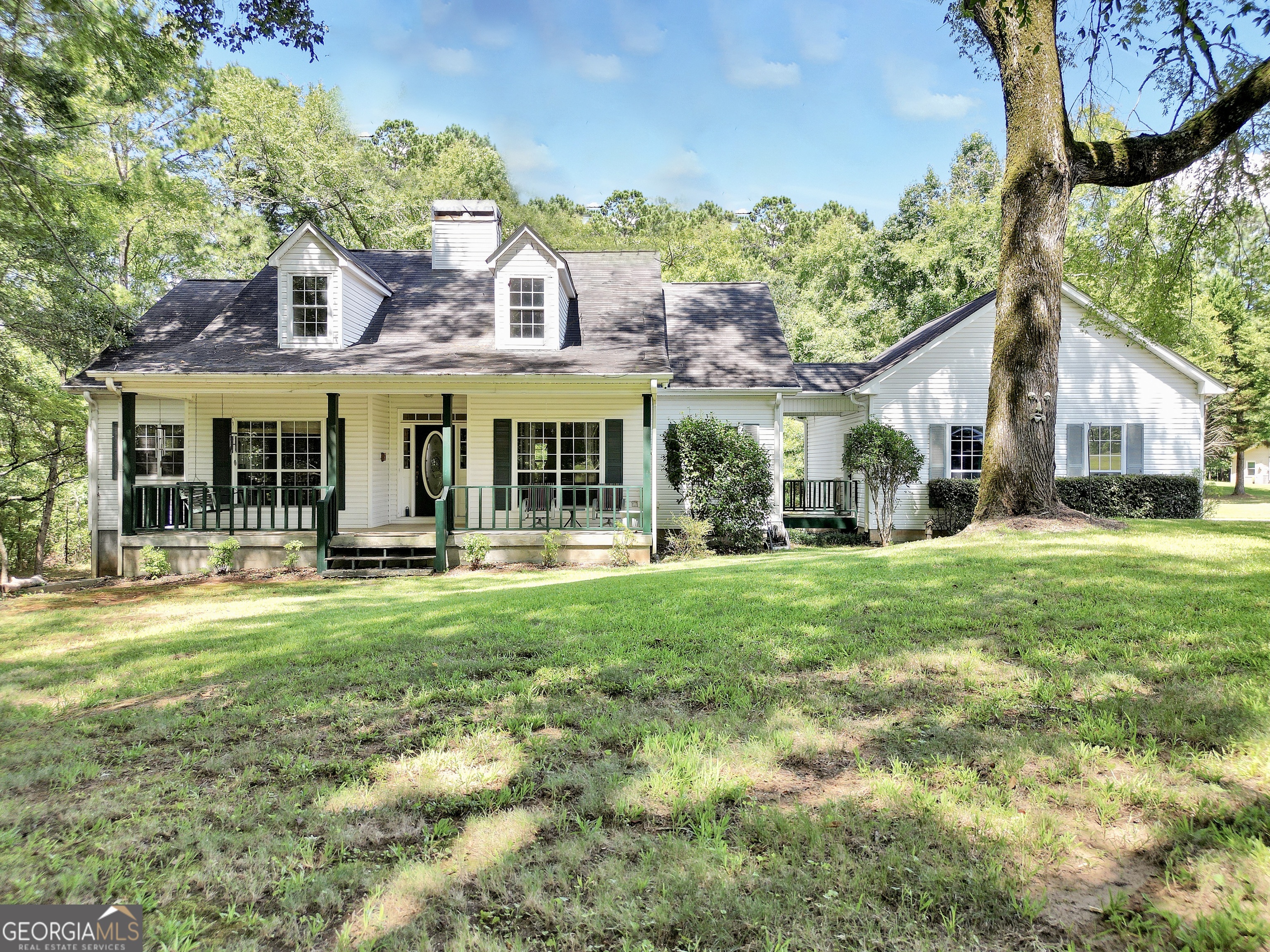 Charming Ranch Home on 3.2 Wooded Acres with Workshop & Modern Upgrades Don't miss this beautifully maintained ranch-style home set on a spacious 3.2-acre wooded lot, offering the perfect blend of privacy, functionality, and country charm. The property includes a 20x20 workshop with electricity, water, a garage door, and a lean-to for additional storage-ideal for hobbies, a home-based business, or extra space. Step inside to an inviting, open-concept layout featuring an updated kitchen with granite countertops, pantry cabinets, and modern finishes. The kitchen flows seamlessly into the breakfast area and living room, creating a large, central gathering space. A split bedroom plan offers privacy for the primary suite, while spacious secondary bedrooms ensure comfort for family or guests. A separate dining room doubles as a perfect home office, and the oversized laundry room provides additional storage and workspace. Step out back to a covered deck, ideal for outdoor dining, morning coffee, or simply enjoying the peace and quiet of the wooded surroundings. The property provides room to garden, roam, or just relax in nature.
