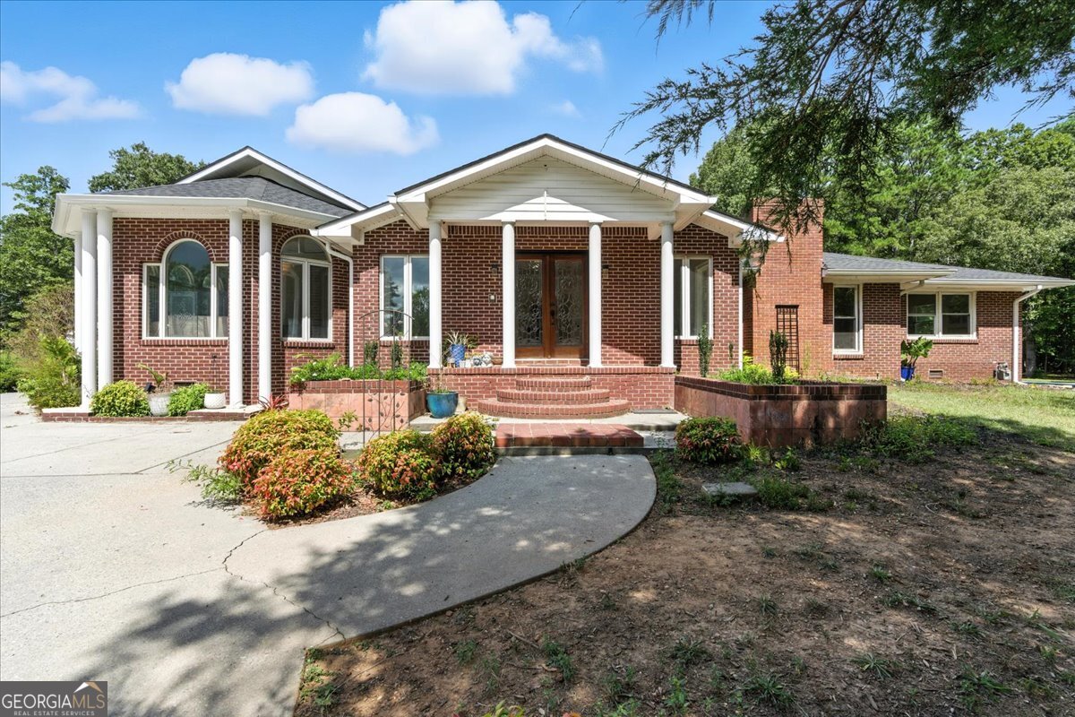 Your own private oasis just minutes from town! This 4-bedroom, 4-bath brick ranch is nestled on 11+/- acres with its own pond and a host of recent upgrades. In the last three years, enjoy peace of mind with a new roof, gutters, pool liner, concrete patio, front door, updated light fixtures, fresh interior paint, new flooring, kitchen appliances, ductwork, and more-including a refreshed bathroom off the sunroom and cleared land. The kitchen opens to the dining area and cozy sitting room, creating a great flow for everyday living. The spacious owner's suite features a private bath and a large walk-in closet. A generously sized all-weather sunroom offers endless possibilities for entertaining or relaxing while enjoying the view. The home is serviced by county water, and there's a well on the property for exterior use-perfect for irrigation or outdoor needs. A rare opportunity for space, privacy, and convenience!