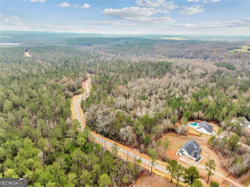 FINAL LOTS AVAILABLE!!! Survey and Soil Test already complete! Welcome to The Gates at Harmony Grove, one of Jackson County's most beautiful estate lot subdivisions. Located just minutes from Jefferson, Commerce, Athens, and Nicholson, this amazing piece of property will be sure to take your breath away. The community features 15 estate sized lots ranging from 8-16+ acres, as well as a private gated entrance, private gravel (soon to be paved) road, streetlights, and underground utilities. This lot is unique and features mature hardwoods, pines, and an abundance of wildlife. Protective covenants and HOA in place to share maintenance of the road, streetlights, and gated entry upkeep. Come build your dream home on the last remaining parcel in The Gates at Harmony Grove. Builder, Kingsworth Construction & Custom Homes. Don't know where to start? We have you covered from beginning to end and will make sure the process is easy and stress free. Don't miss this opportunity to secure your estate homesite in the Jackson County school district!
