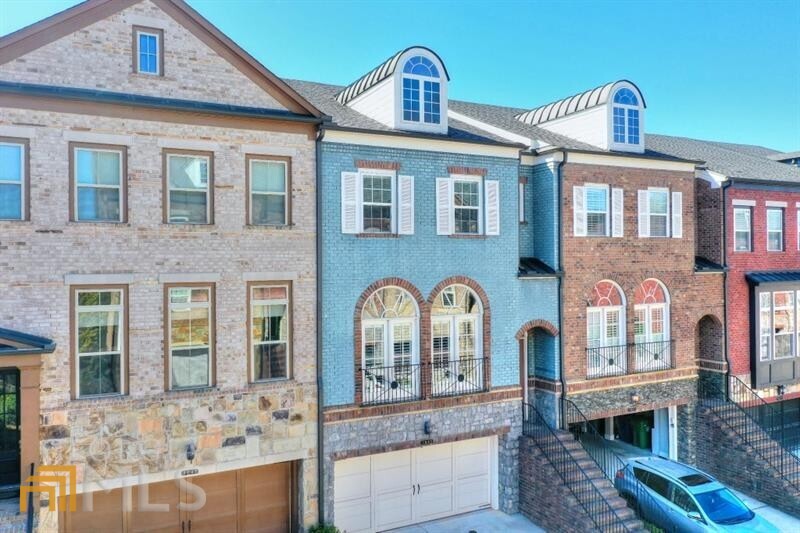 Incredible and walkable Brookhaven location! High end, mint condition townhome with elevator. Open and large main level layout with covered back deck. Kitchen offers lots of food prep and storage space. Huge kitchen island. Primary bed suite has walk-in closet and spacious bath with double vanities and walk-in shower. Walk to restaurants, shopping, Whole Foods, Publix, the pool, Blackburn Park & pool. Terrace level w/ second great room, walk out patio, additional bed/office and full bath. Elevator goes to all 3 levels.