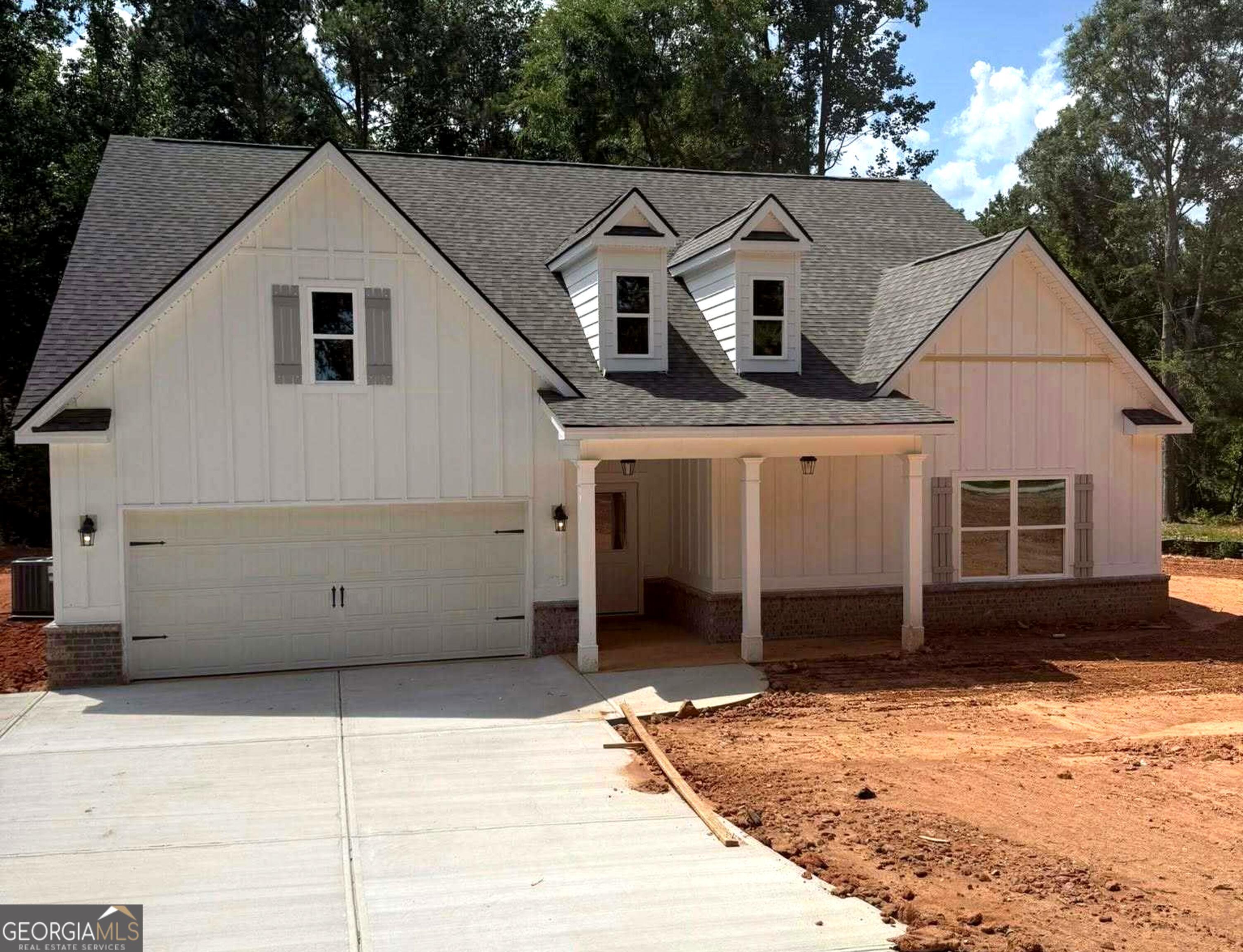Experience peaceful living in this brand-new 4-bedroom, 3-bath ranch-style home nestled on 1.8 acres in beautiful Jackson County. With 2,929 square feet of open-concept living, this thoughtfully designed home features a spacious front and backyard, professional landscaping, and a wooded backdrop for added privacy. Enjoy a light-filled open floorplan with the primary suite conveniently located on the main level, complete with oversized walk-in closets and a beautifully tiled master bath. Modern finishes, generous living spaces, and a seamless indoor-outdoor flow make this home perfect for both everyday comfort and entertaining. Move-in ready and built for easy living-your dream home awaits. *Professional photos will be uploaded Friday*