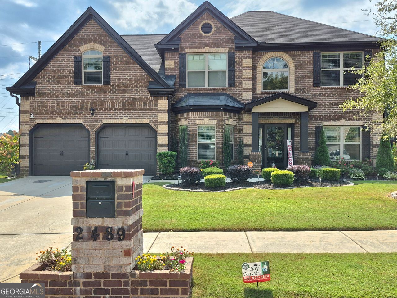 This showstopper has arrived with curb appeal that commands attention! As you approach, the first thing you will notice is its undeniable presence and charm. As dusk falls, the home takes on a magical quality with professionally installed exterior uplights that graze the architecture, highlighting its best features and creating a stunning nighttime silhouette. Features include striking new interior lighting fixtures, a two-story foyer entry with a dazzling chandelier, granite countertops, all stainless steel appliances, a breakfast bar, and a family room with a fireplace that opens to the kitchen. Additional highlights are upgraded luxury fixtures, coffered ceilings, new hardwood floors on the main level, a tray ceiling in the formal dining room, an in-law suite on the main, his & hers closets, a double vanity, and a spacious yet elegant owner's retreat with a lovely sitting area. The private yard has been newly fenced and painted, creating your own outdoor sanctuary. A beautiful new shed provides practical storage, while an expansive new concrete patio extends your entertaining space. From there, your eyes are drawn to the elegant gazebo, standing as the centerpiece of the yard, and a custom paver stone walkway that gracefully guides you to the front door-hinting at the quality within. This same attention to detail is reflected in the immaculate landscaping in both the front and back yards. And let's not forget-this chateau is a smart home, too. No HOA... This home is the complete package and it's calling your name. Just minutes to I-20, I-285, and shopping.