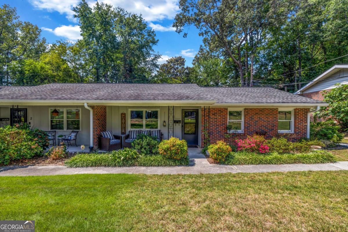 Incredible Opportunity in Brookhaven! Discover this rare ranch-style end-unit condo in the desirable Ashford Park Condo Community, perfectly located with no rental restrictions (except short-term rentals) and low HOA fees. Enjoy true one-level living with easy access to I-85, GA-400, and I-285, plus close proximity to restaurants, parks, Marta, shopping, Costco, Whole Foods and so much more. This 2-bedroom, 1-bath home has been freshly painted and features an open-concept layout designed for comfort and style. The kitchen shines with marble countertops, stainless steel appliances, and white cabinetry, flowing seamlessly into a sunny breakfast area and spacious living room. The primary suite and secondary bedroom both offer generous space and closets, while the full bath boasts custom tile and a seamless glass shower. Additional highlights include: Two assigned parking spaces Step-free front entry with a covered porch and community greenspace, ideal for relaxing or enjoying with pets. Convenient rear entry with just a few easy steps. Whether you're looking for a move-in ready home or a prime investment property, this Ashford Park gem checks all the boxes.