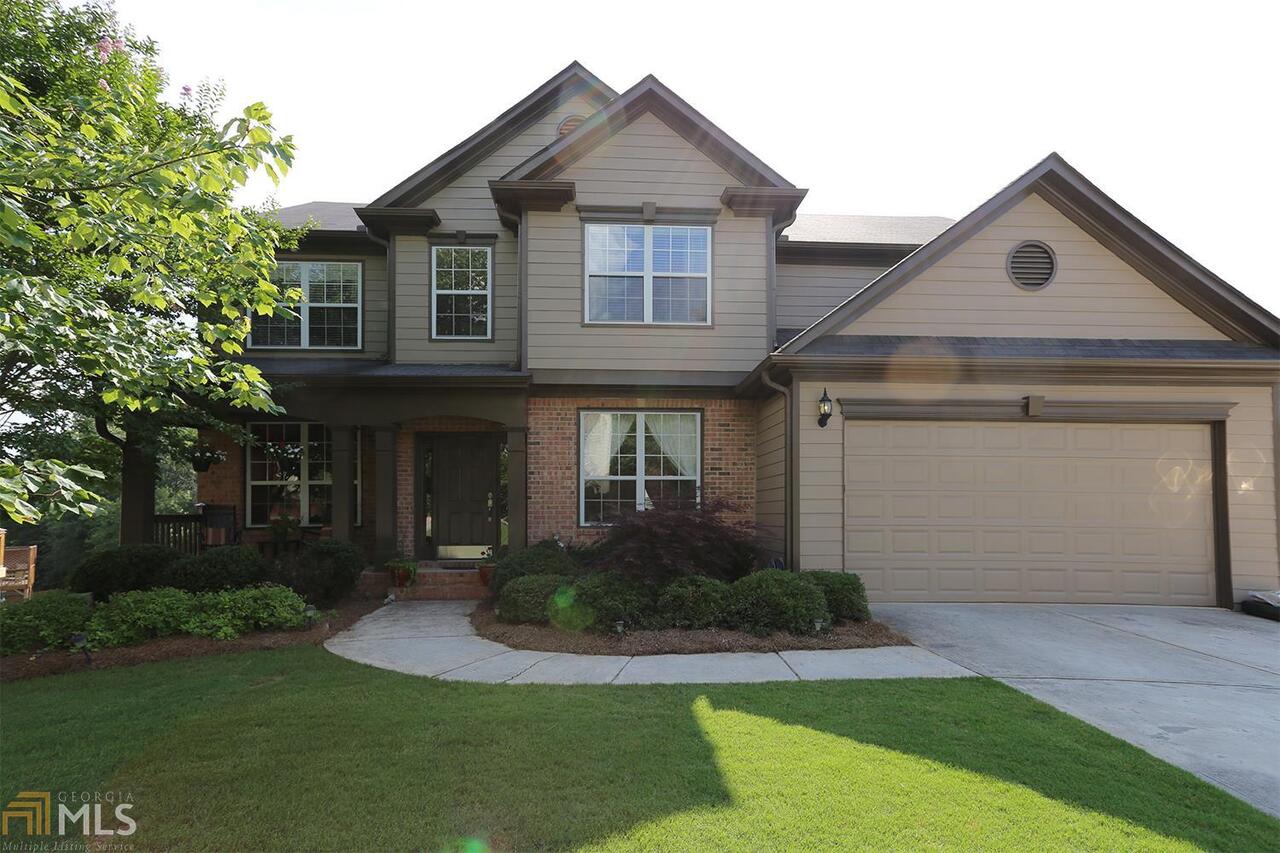 Gorgeous well maintained home in the sought after Laurel Park Community. This home is centrally located & just minutes from Lake Lanier, Sugar Hill Golf Course & 85. Desirable Gwinnett Schools and a swim/tennis community w/large park & sidewalks thruout. Upper level of home features 4 lrg bdrms & Laundry Area. Main level is open & spacious w/gorgeous great room,access to upper deck,sep large living & dining rooms,bonus room (could be guest room/office). Lower level is stubbed & ready for easy expansion. This is the largest lot in the community! Manicured fenced in yard.