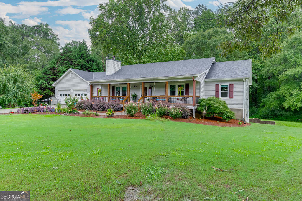 FIRST TIME ON MARKET!! For Sale RANCH Plan on Full Basement -Nestled in the tranquil countryside of Dacula, GA, this well maintained TRUE RANCH PLAN on FULL Unfinished Basement property offers a perfect blend of rural serenity and modern convenience. With its expansive lot and inviting home, it's an ideal setting for those seeking a peaceful escape while still being within reach of local amenities and major roadways. Features include: 1.71 acres +/- with no HOA (room to build a 2nd house?), ample outdoor space for gardening and entertaining, true ranch plan on full unfinished basement with BoatDoor, three bedrooms and two full baths, country kitchen and comfortable living room. Deck off the kitchen overlooking private partially fenced backyard, oversized two car attached garage plus detached covered RV parking. Public SF is stated incorreclty. This property offers tons of opportunities!