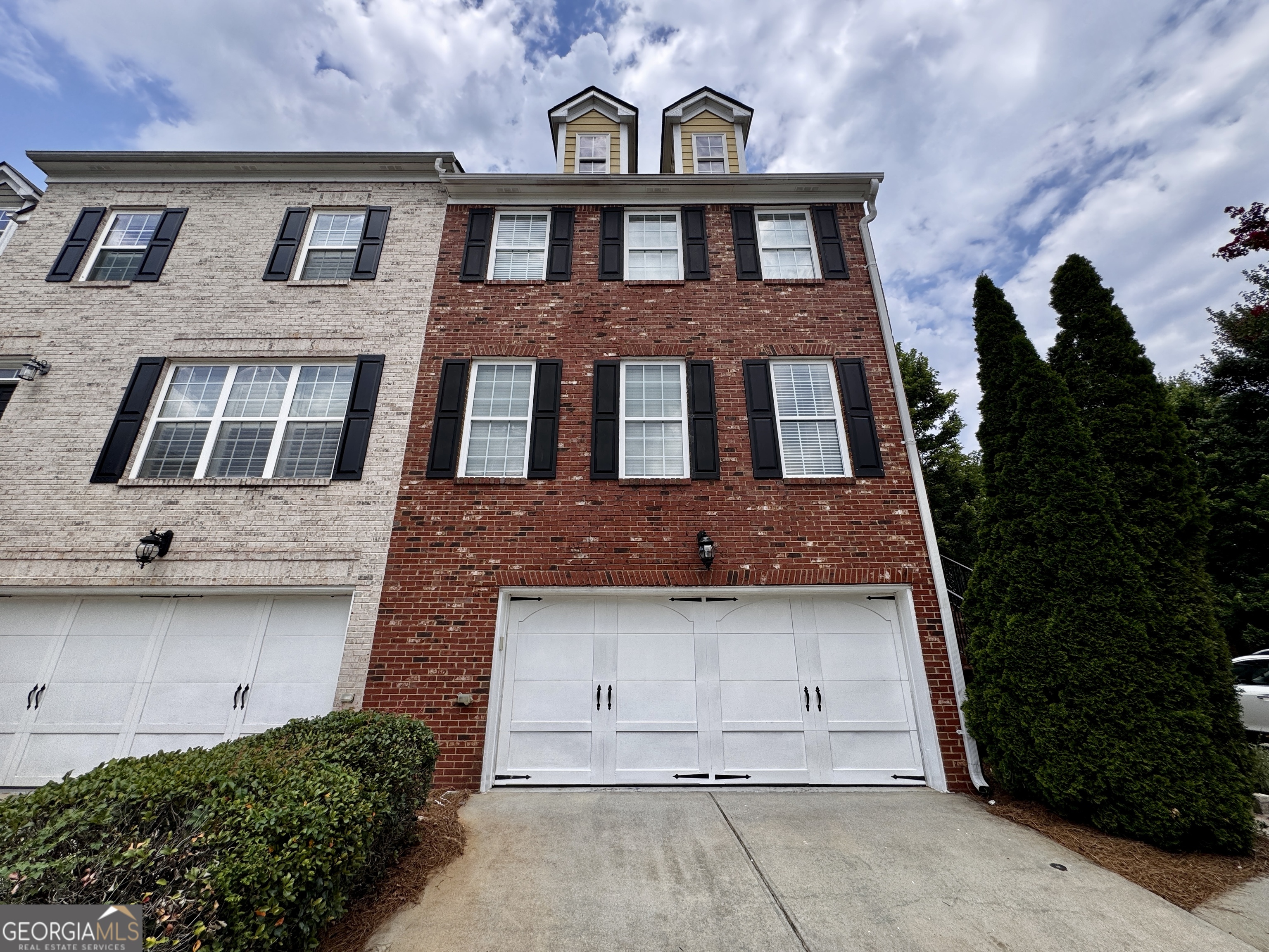 Rare 4BR/3.5BA End-Unit Townhome with Exclusive Features in Prime Peachtree Ridge District. Welcome to this exceptional end-unit townhome, a rare gem in the highly sought-after Ewell Parc community, located in the top-rated Peachtree Ridge High School district. With 4 spacious bedrooms and 3.5 bathrooms across three finished levels. The only unit in the community with two additional parking spaces, perfect for guests or multi-car households. Enjoy the added space of a larger private backyard with its premium end-cap location. Step inside to find a bright, open-concept main floor featuring hardwood floors, a spacious living room with an electric fireplace, and a modern kitchen complete with tile countertops, stainless steel appliances, cabinetry, and a Walk-in pantry. Upstairs, the oversized primary suite has dual closets and a master bath with His & Her vanities, a soaking tub, and a separate shower. Two other upstairs bedrooms share a full bathroom, providing perfect space for other family members. The fully finished terrace level offers an additional private bedroom and full bath, ideal for an in-law suite, teen retreat, or home office. Convenient access to Sugarloaf Mills, I-85, and Hwy 316, just minutes from shopping, dining, and entertainment.