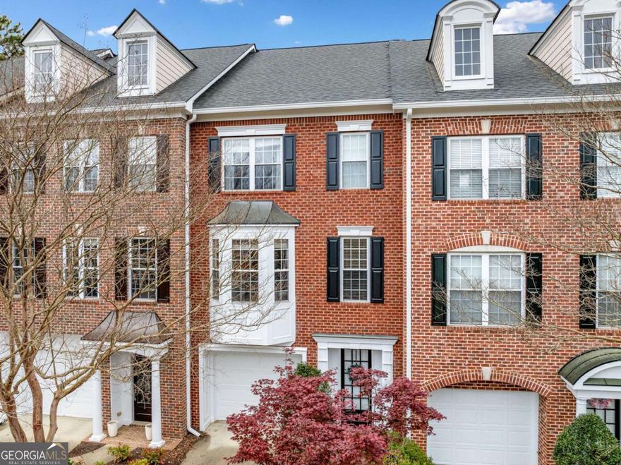 Welcome to the Heritage at Roswell, a gated community where timeless elegance meets modern convenience. This classic two-bedroom, two-bath townhome combines comfort, style, and a great location. It's just minutes from Downtown Roswell and GA 400. As you enter, you'll notice the bold and stylish entrance with an eye-catching leopard print carpet on the stairs. The large living room gets lots of natural light from a lovely bay window. It has built-in shelves and a warm gas fireplace. The kitchen is a stylish center of the home. It has neutral cream cabinets, granite countertops, and stainless steel appliances, including a gas range. The central island provides extra counter space, and the eat-in area and attached sunroom are perfect for casual dining. Upstairs, the primary suite is a serene retreat, complete with a sitting room, a spa-inspired en suite bath, and a generous walk-in closet. The secondary bedroom also features a walk-in closet and an en suite bath, providing privacy and convenience. A dedicated laundry room completes the third floor. Hardwood floors flow throughout the main level, while plush carpet adds warmth upstairs. Recent updates include a brand-new roof and exterior repairs & paint(2024) and a newly updated HVAC system (2020). The two-car tandem garage provides ample parking and storage space. The Heritage at Roswell offers a resort-style life. Enjoy the pool, tennis courts, clubhouse, and beautiful lake. You'll also enjoy the nearby green space and easy access to dining, shopping, and entertainment options. Don't miss out! Experience the perfect mix of luxury, location, and lifestyle. Schedule your private showing today!