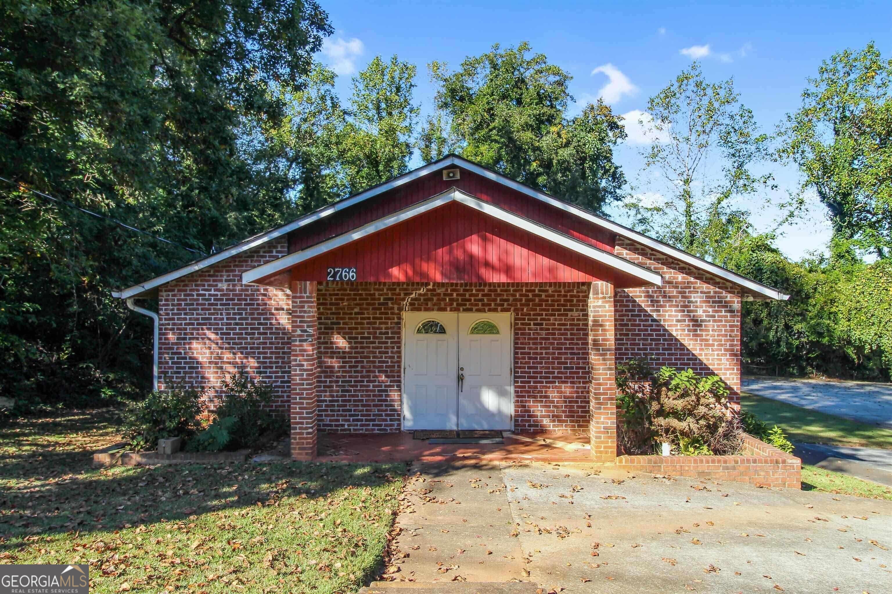 Fantastic location in downtown Decatur. Property has at least 25 parking spaces and is situated in a residential/commercial area. Property is currently zoned multi-family residential. Space is equipped with full kitchen downstairs.
