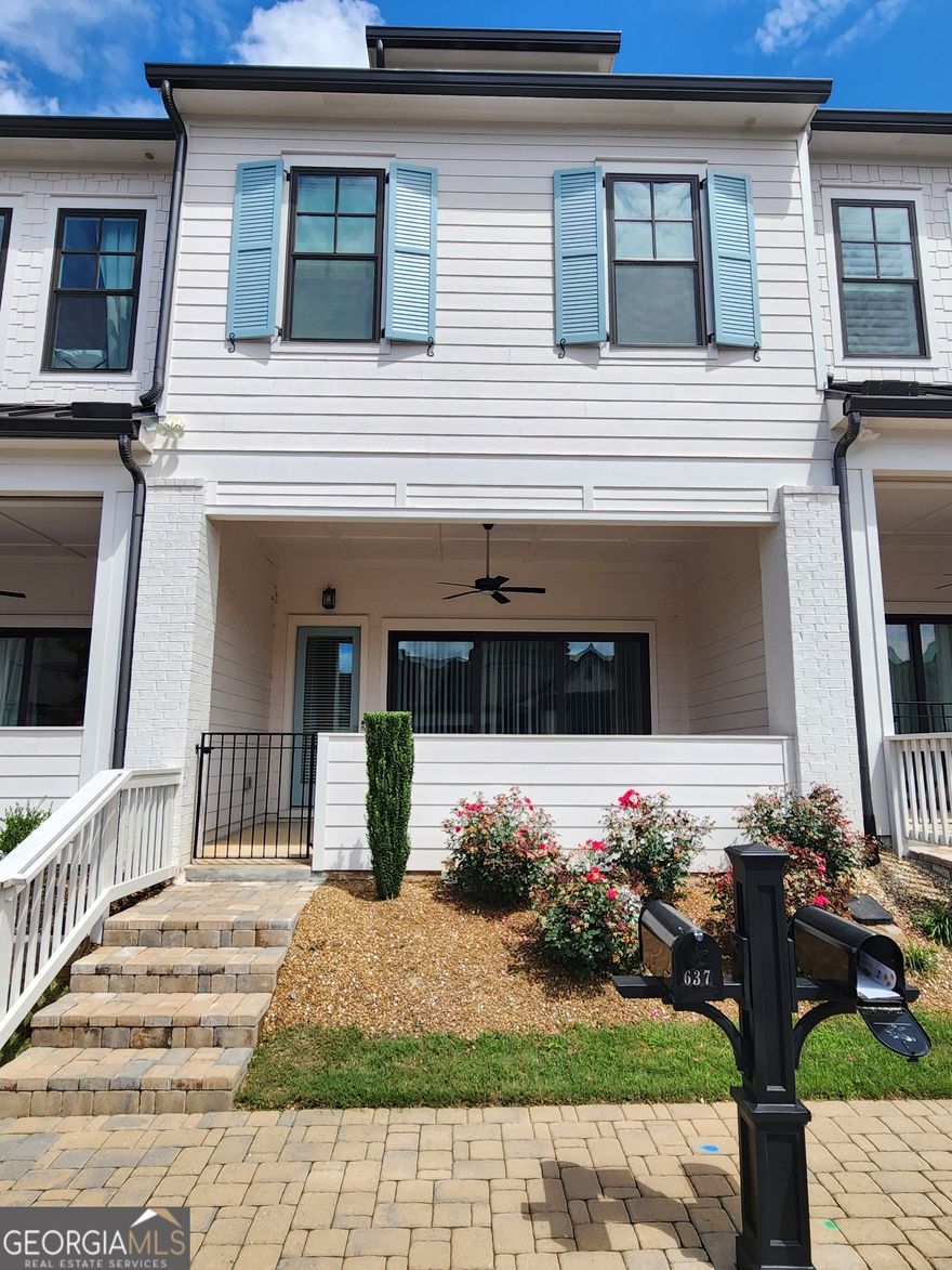 Stunning Home with an inviting, OPEN-CONCEPT layout. Prepare to be captivated by the exceptional TOWNHOUSE. Step into a realm of sophistication curated by designers.                                                                                                                                                                                                                                                                                                                                                                                                                                                                    The HEART of this home at the 1st floor (Walkin level), the kitchen, is a culinary haven featuring 42" cabinets, adorned with exquisite QUARTZ countertops. It's a space where culinary dreams come to life, a testament to both style and functionality. As you enter the family room, be greeted by the warmth of a cozy ELECTRIC FIREPLACE, elegantly framed with SHIPLAP stretching to the ceiling. This space is more than just a room; it's an invitation to unwind, to create memories, and to truly experience the comforts of home.                                                               The LARGE SLIDER DOOR of the 11ft ceilings in the family room open to a beautiful OUTDOOR PATIO with a COVERED PORCH great for entertaining or enjoying your morning coffee.                                                                       Upstairs, you'll find a versatile loft space you can transform to fit your needs. The owner's suite showcases an oversized shower and expansive WALK-IN-CLOSET DESIGNED by Space Makers. Two additional secondary bedrooms with an additional bathroom.                                               However, what truly sets this home apart is not just its luxurious interior but also its exceptional LOCATION. Nestled within the SECURE GATES of an amenity-rich community, you'll have the world of convenience and leisure right at your doorstep.                                                                                                                                                                  Welcome to a neighborhood where elegance meets comfort, where luxury becomes an everyday affair. Not only will you enjoy the stunning features of this new home, but the community is also gated and beautifully maintained at a convenient location:                                                                                                **  Within ~10 minutes from Costco, Walmart, Target, Sam's Club, and several restaurants in Downtown Woodstock                                                                               ** Within ~15 minutes of KSU                                                                                                                                                                                                                     Village at Towne Lake offers a range of excellent amenities to enjoy such as:                                               ** A LARGE luxury CLUBHOUSE                                                                                                                                                                                                    ** community fitness center / GYM                                                                                                                                                                                     ** POOL, PICKLEBALL COURT, bocce ball, FIRE PITS                                                                                                                                                         ** Multiple DOG parks                                                                                                                                                              *Some Pictures of the model home is also added to show the full potential and for illustrative purposes only.
