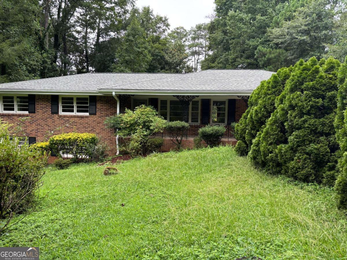 4 Sided Brick Ranch On Full Basement* Finished Area In Basement Includes 2nd Kitchen, Living Room, Bedroom, Full Bath & Laundry Space With Its Own Private Entrance* Possible Rental Or In-Law Suite* NO HOA* Located In Well Established Neighborhood* Hardwood Floors Throughout* 3 Year Old Roof* Private Lot Overlooking Beautiful Wooded Area* New Kitchen Range* Masonry Fireplace* Highly Rated Parkview High School* Great Location Close to I-85* TAXES DO NOT include Homestead Exemption