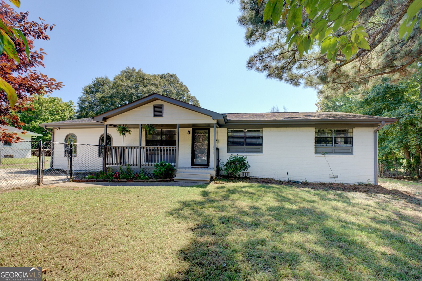 Come out and see this beautiful open concept 3 bedroom 2 bath ranch home in the heart of Loganville. Minutes away from HWY 78, close to shopping centers, parks and even the city library. The home features a large master bedroom with walk in closet, LVP flooring throughout the home. Kitchen opens up to living room and dining room. Stainless steel appliances fairly new HVAC, and roof. Great covered front porch ready for some rocking chairs to enjoy the outdoor space. Leveled backyard is perfect for entertaining. Storage unit will stay with the property. No HOA!!!