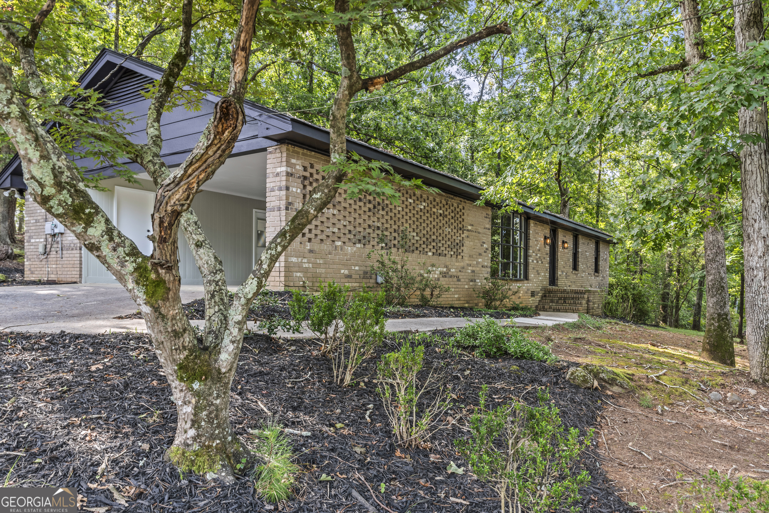 Location is everything, and this all-brick charmer delivers! Welcome home to this beautifully renovated, all-brick 3 bedroom, 2 bath ranch in one of Athens' most desirable locations-Kingswood Subdivision, directly across from Timothy Road Elementary! It sits on almost an acre. This home blends modern updates with classic charm, featuring a cozy fireplace, spacious living areas, and a 2-car carport for everyday convenience. The private, wooded lot offers room to relax, along with a large fenced dog kennel that's perfect for pet lovers. Whether you're sipping coffee on the back patio or entertaining friends, you'll appreciate the peaceful setting while still being just minutes from shopping, dining, UGA, Downtown Athens, Hwy 316 and Hwy 78. Move-in ready and in a highly desirable area, this home checks all the boxes!