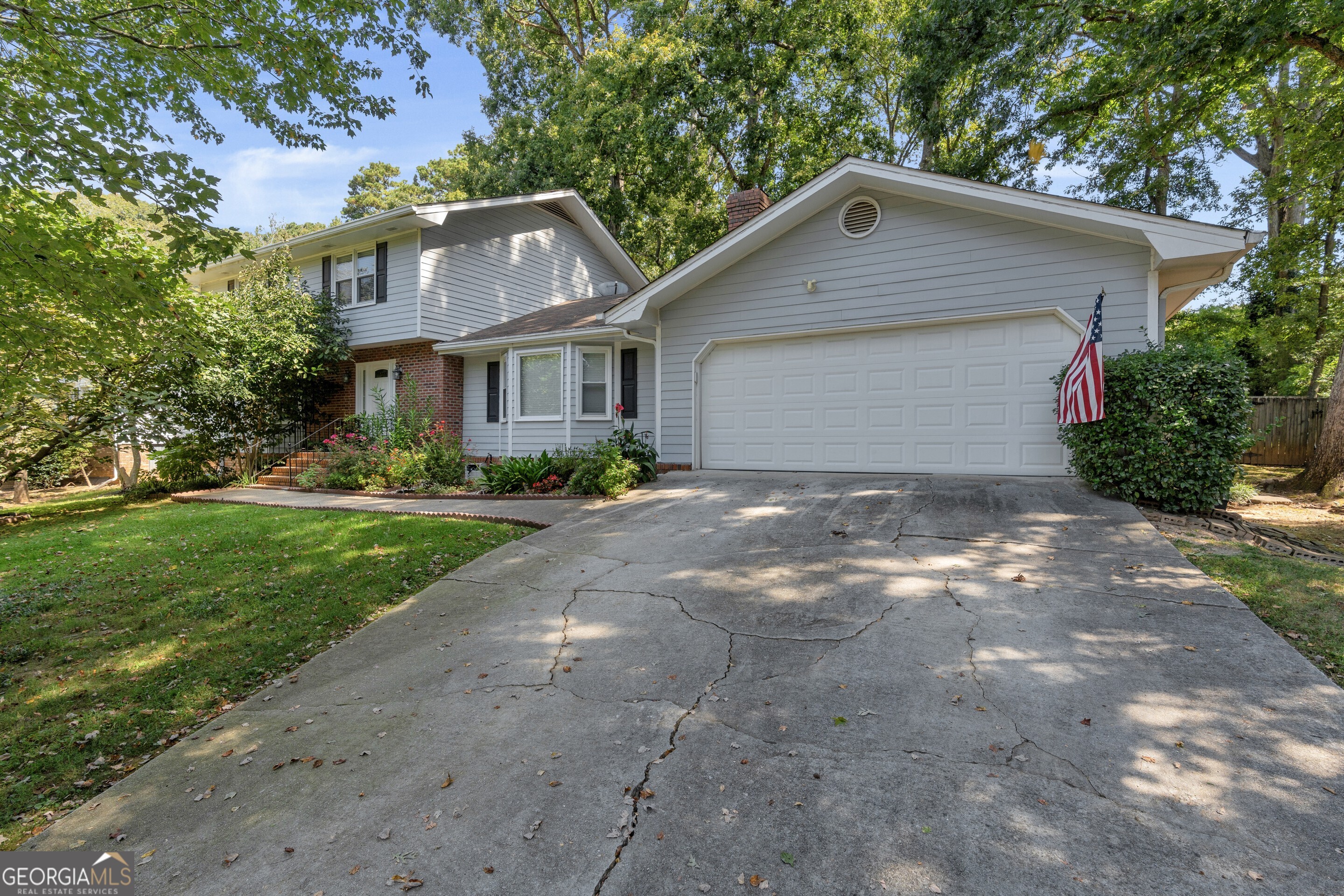 Beautifully Updated & Immaculately Maintained Home in an Ideal Location No HOA! Welcome to 2028 Harbour Oaks Drive, perfectly situated in the highly desirable Brookwood High School District. This prime location offers unbeatable convenience just minutes from major highways, shopping centers, popular restaurants, Stone Mountain Park, healthcare facilities, and multiple local parks. Inside, the home shines with modern renovations and meticulous care. The main level features a spacious family room anchored by an elegant fireplace and a bright, updated kitchen with white cabinetry, granite countertops, a tasteful backsplash, stainless steel appliances, and a center island with an inviting eat-in area. A versatile flex room on the main floor can serve as an additional great room or a fifth bedroom. Upstairs, the primary suite includes a modern bathroom with attractive tile finishes, while three generously sized secondary bedrooms share a stylish bath with a dual vanity. Step outside to a private, park-like fenced backyard, beautifully landscaped and featuring a large patio perfect for relaxing or entertaining. This home is exceptionally clean and move-in ready, combining modern comfort with a prime location.