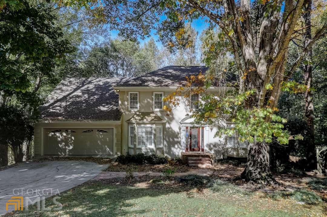 This Peachtree Corners two-story cul-de-sac home offers a patio, granite countertops, and a two-car garage.