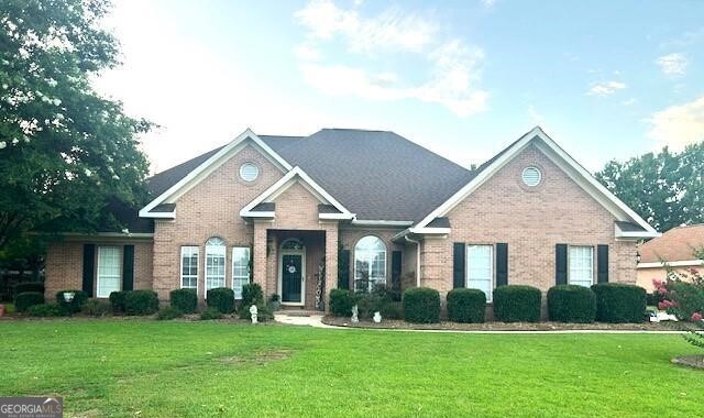 Look no further! This home can be yours! All brick four bedroom home with split plan. Spacious master suite with bath featuring large jetted tub plus separate shower. Formal dining room and separate living room/office off foyer. Granite counter tops in kitchen with lots of cabinets. Island does not stay. Huge greatroom with gas log fireplace. Additional bedrooms are all a good size. LVP flooring within last two years. H&A approx. 4 years old and roof approx. 6 years old. Screen porch and separate patio. There is an amazing 20x20 outbuilding with roll up door, every man's dream! Two car side entry garage. This home has everything you need and ready to move in after closing.