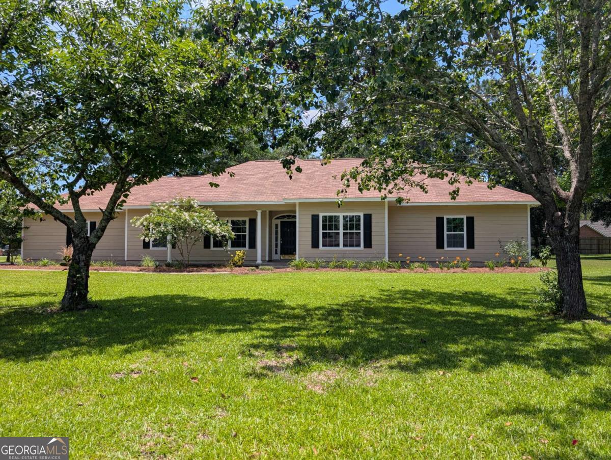 REDUCED! $10,000 DROP IN PRICE. MOTIVATED SELLER! Bring us an offer. Easy to show. Beautiful, Updated and Move in Ready! Only thing missing is you! You will love the yard with its flowering trees and its landscaped nicely. Quiet and well-established subdivision. Perfect for raising your kids or a retiring couple wanting a quiet place to live in county but close to town, hospital, and shopping in beautiful downtown Jesup. With-in 30 minutes of Fort Stewart, 1 hour or less to the Golden Isles Beaches. There is 2700 square foot of enjoyable living space here with a large addition bonus room with surrounding windows, that can be used as the Family room/ Sunroom and where you can enjoy the view of the back yard, which has the perfect set up for a above ground pool. 3 Bedroom 2 Bath. From the master bedroom you can enter the master bath, walk through it to a large organized shelved master closet. All bedrooms are spacious. As you enter the home your greeted with elegant Archways, Formal dining room and a place where you can cozy up on those cool days by the wood burning fireplace in the Living Room which has 11-foot tray ceiling I might add! The rest of home has tall 9-foot ceilings. All ceilings are textured knockdown ceilings. The Kitchen has an abundance of storage, Farm Stainless steel sink, new granite counter tops, new dishwasher, newly installed electric stove. A Breakfast area with a large window to enjoy the view with your morning coffee. Fresh Sherwin Williams paint on interior (City loft) and exterior (Summerhouse beige). There is so much more so let's don't stop here. 2 new HVAC units, Large 2 car garage with a bonus room, a spacious laundry room, new ceiling fans, deep well, 5 zone sprinkler system, LVP flooring throughout, Tiled bathroom flooring. Outside storage building and Sidewalks from the paved driveway to the front door. On top of all this, located in one of the top neighborhoods in Wayne County with Wonderful neighbors. bring your offers! "Sounds Like Home to Me"