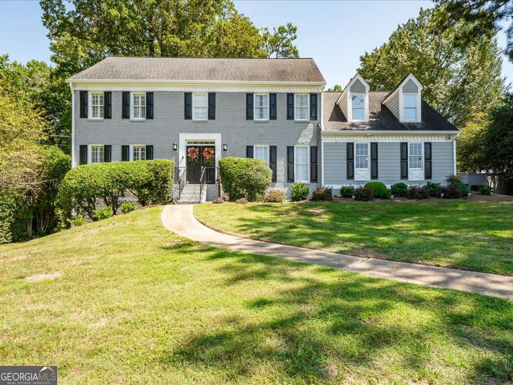 Gorgeous Renovation with Pool Oasis in Vanderlyn! This move-in ready Dunwoody gem is loaded with upgrades and designer finishes-new kitchen and baths, fresh paint, and hardwood floors. The oversized great room wows with a beamed ceiling, stacked-stone fireplace, and sleek quartz bar. The bright, modern kitchen boasts new cabinetry, quartz countertops, and stainless steel appliances, seamlessly connecting to a dining/desk area and vaulted sunroom filled with natural light. Dual staircases lead upstairs to a primary suite retreat with trey ceiling and a stunning new vaulted bath featuring skylights, a luxurious tile shower, soaking tub, and double quartz vanities. Three spacious secondary bedrooms include an oversized suite, perfect for guests or flex space. The finished basement adds new LVT flooring, a large entertainment room, plus an additional bedroom and full bath-ideal for in-laws, teens, or visitors. Step outside to your private oasis: French doors open to a covered deck overlooking a level, landscaped, fenced backyard with a sparkling pool and rare privacy-you'll barely notice neighbors. Major updates include new carpet, HVAC, two water heaters, and a new garage door. All of this in the heart of Dunwoody, within the coveted Vanderlyn district-where location, lifestyle, and luxury meet.