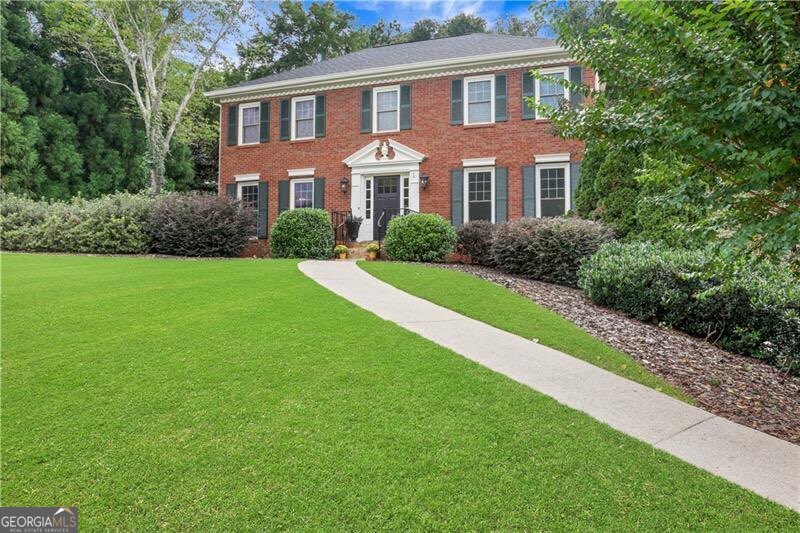 Move-In Ready! Welcome home to this beautifully updated 4 bedroom, 2.5 bath residence located in the heart of Johns Creek, within the highly sought-after Northview High School district and just minutes from the new Town Center. Step inside to find fresh paint inside and out and gleaming hardwood floors throughout the main level. The chef's kitchen is a standout, featuring a Thermador range with gas burners and electric oven, brand-new countertops, sink, and lighting. The kitchen opens seamlessly into the family room with a cozy fireplace-perfect for gatherings and entertaining. Upstairs, the primary suite offers hardwood floors, a trey ceiling, and a luxuriously renovated bath with a soaking tub, glass shower, and walk-in closet. Three additional nicely sized bedrooms and full bath are also located on the second floor. Enjoy outdoor living year-round on the large screened porch (off kitchen) with refinished hardwood floors, overlooking a private, new custom fenced backyard. Located near endless options for dining, shopping, and entertainment, this home truly has it all.