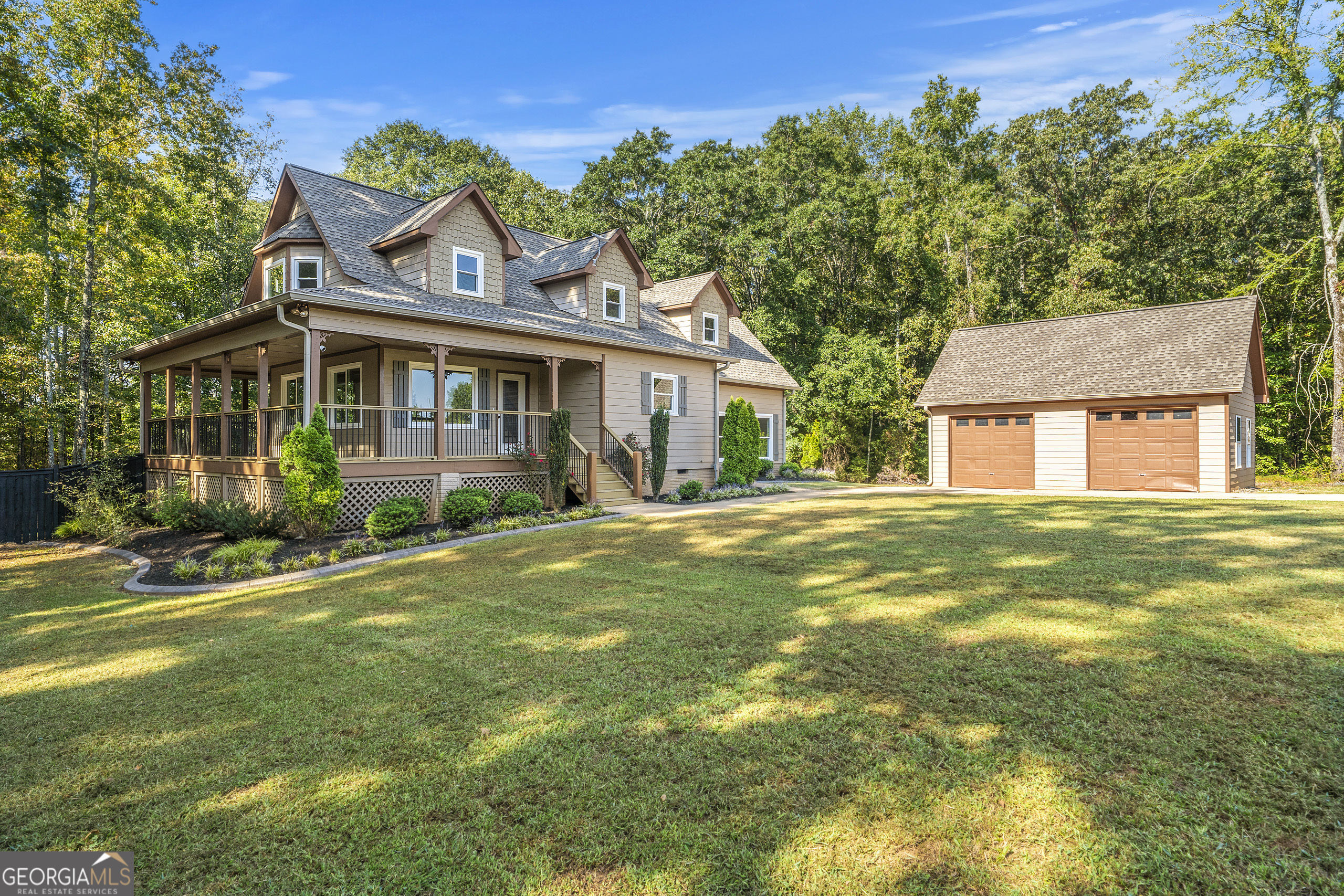 Welcome to your dream home in the heart of Senoia - a place where southern charm, space, and comfort come together on a stunning 2-acre property. With nearly 2,400 square feet of living space, this inviting 5-bedroom, 3-bathroom single-family home offers the perfect blend of privacy, versatility, and warmth. From the moment you arrive, the classic wrap-around porch sets the tone, inviting you to slow down, sip sweet tea, and enjoy the peaceful surroundings. Step inside and you'll find a spacious, flexible floor plan designed to accommodate both family life and entertaining. With five bedrooms, there's room for everyone - whether you need a home office, guest suite, or playroom, the possibilities are endless. Outdoors, this property truly shines. The detached 2-car garage provides plenty of storage and workspace, while the fenced backyard is ideal for pets, play, or relaxing evenings under the stars. For those who've dreamed of a small homestead, the two additional fenced-in areas offer the perfect setup for mini-farms, gardens, or hobby animals. Here, you can enjoy the best of country living without sacrificing convenience. Located just minutes from downtown Senoia, you'll have easy access to local shops, restaurants, and community events - all while enjoying the peace and quiet of your own private retreat. This is more than just a house; it's a lifestyle, offering space to grow, create, and make lasting memories. Don't miss the chance to call this unique property home - where every day feels like a getaway, and the best of Georgia living is right at your doorstep. *Listing Agent is Owner*