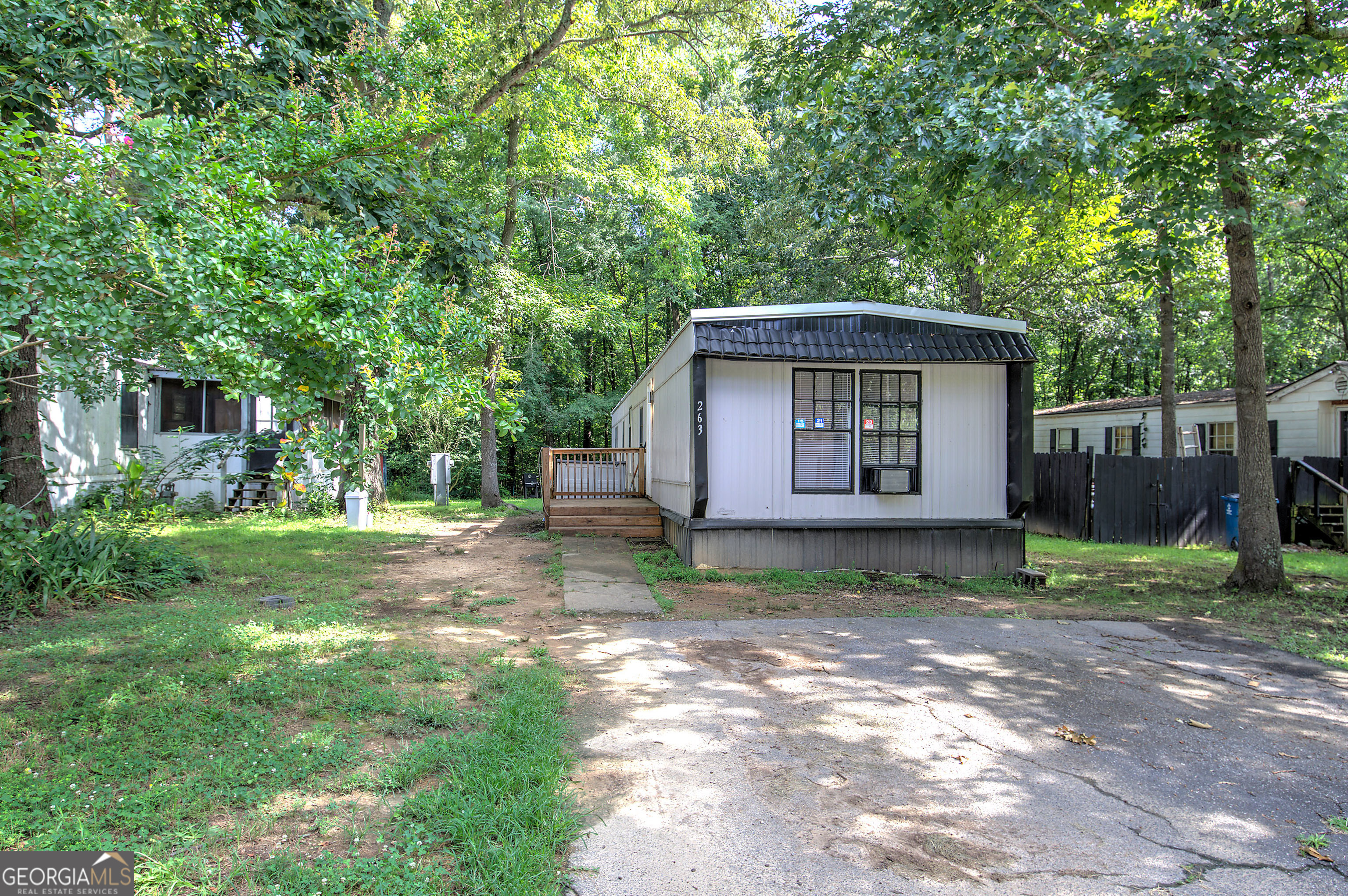 Charming Manufactured home located in Swan Lake Mobile Home Park. This home is a 3 bedroom 2 bathroom home. New Metal Roof. New tile flooring in Kitchen. New laminate flooring in living room. All appliances will remain with home. Fresh interior paint. Enjoy mornings on the oversized front porch. The homes comes with one window unit. This home can be financed through Vanderbilt Mortgage and Finance. Must pass background check Swan Lake. Lot rent each month is $595 plus $20 for trash. Water and sewage is a separate amount that is paid with lot rent.