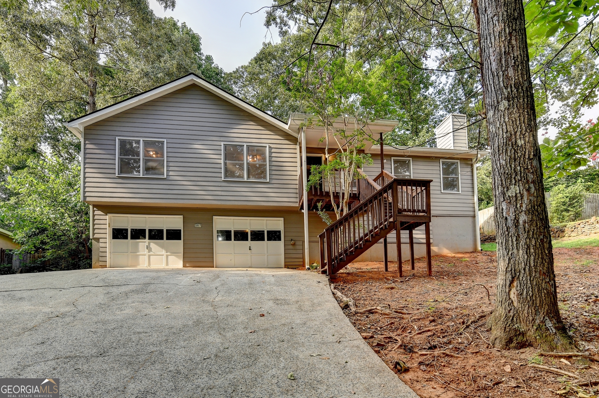 Welcome to your charming new home in the heart of Woodstock! This delightful 3 bedroom, 2-bathroom residence offer 1,456 square feet of thoughtfully designed living space, perfect for modern comfort and daily convenience. Discover the freshly painted interior and open floor plan that flows from the kitchen to the dining and living areas. The kitchen stands out with stainless steel appliances, granite counter tops and a view of the large fenced backyard-idea for weekend barbecues and badminton games. The spacious primary bedroom provides peaceful retreat with full en-suite bathroom and plenty of natural light. Just minutes from downtown Woodstock, you'll love being close to great restaurants, shopping, and local events. The roof was replaced in January of 2025, as well as the garbage disposal and microwave. Furnace new in 2018, A/C 2014. All lights and fixtures just replaced. This home also features gutter guards and ring door bell. Come see just how much this home fits your needs.