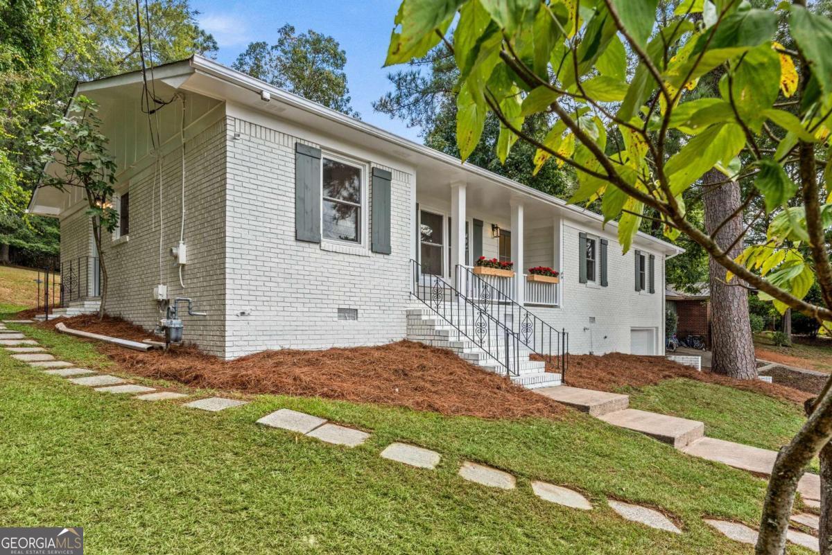 What an amazing transformation brought to you by Riley Wilson Design and Interiors. This is your opportunity to own a complete renovation inside the Perimeter in the thriving Normaltown area of Athens, Georgia. The extensive redesign incorporates functionality, timeless character, and modern simplicity in a sophisticated space you can call home. The detail with which this home has been reimagined is unsurpassed, featuring multiple pocket doors, crown molding, and original, refinished hardwood floors adding timeless character and warmth to every room. The open floor plan experienced in the one level living features a common area designed for togetherness, laundry room with drop zone, half bath, a primary bedroom with en suite and two additional bedrooms with jack n Jill bath. The kitchen is a fabulous focal point and rightly so. The island is enormous, the work space is more than gracious, and the pendant lighting is on point. Elegant, gourmet features include custom, soft-close cabinetry, under cabinet lighting, quartz countertops, subway tile backsplash, statement gold hardware, and stainless steel appliances. Additionally a butlers pantry expands the kitchen, providing added storage, prep space, and open shelf accents. In the 21st century, the laundry room is a multipurpose necessity and this one delivers in size, storage, and custom built-ins. All bathrooms feature new tile, new vanities and modern lighting. The primary bedroom has its own custom built-in, tiled ensuite with water closet, and walk-in closet. Every wall has been rebuilt, all plumbing and electrical are new, a new driveway poured, and new Pella windows have been installed. This is a dream for any and every Athenian. It's an ideal setting on almost a 1/2 acre lot in a well established neighborhood about a mile from UGAs medical campus.