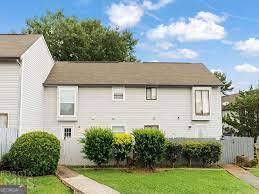 Welcome to 299 Country Club Drive - a beautifully newly renovated 3BR/2.5BA townhome in the quiet and established Country Green Village community. This spacious unit features a bright, open floor plan with new luxury laminate plank flooring, fresh paint, and updated lighting throughout. The kitchen shines with new white shaker cabinets, granite countertops, subway tile backsplash, and stainless steel appliances. Upstairs, you'll find three spacious bedrooms and two fully renovated bathrooms with modern fixtures and finishes. A stylish half-bath is located on the main level for guests. Enjoy the outdoors with a private patio, perfect for relaxing or entertaining. Windows throughout offer improved energy efficiency. Includes two assigned parking spaces. Convenient to shopping, schools, and major highways.