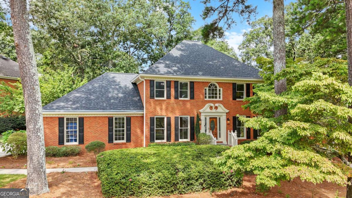 Move in ready 4-bedroom, 4-bath home in the heart of Haralson Hills. Perfectly situated on a corner lot, this spacious residence blends timeless architecture with thoughtful updates, creating a move-in ready home in one of Lilburn's most established neighborhoods. Step inside to find hardwood floors flowing throughout the main level. The floorplan offers flexibility with a formal living room, dining room, and fireside family room that opens directly onto an expanded back deck-ideal for entertaining or quiet evenings at home. The eat-in kitchen has been beautifully refreshed with quartz countertops, abundant cabinetry, a new double oven, and new cooktop. A main-level bedroom and full bath provide the perfect space for in-laws, guests, or a home office. All three upstairs bedrooms feature walk-in closets and new LVP flooring. The oversized primary suite is a true retreat with a renovated ensuite bathroom that includes a soaking tub, enlarged tiled shower with frameless glass door, dual vanity, and updated fixtures. Two additional bedrooms share a full hall bath, making the upstairs both practical and comfortable. The semi-finished basement offers a full bath, flex room, and plenty of storage. It's an excellent opportunity for a home theater, gym, or in-law suite. Outside, the large corner lot provides both space and privacy, with a expanded deck perfect for grilling, gatherings, and enjoying Georgia's four seasons. Recent updates include a new roof, three new HVAC systems, fresh interior paint, new light fixtures and fans, and updated bathrooms-giving peace of mind for years to come. Haralson Hills is beloved for its rolling landscape, mature trees, and community feel. Neighbors wave, children ride bikes, and families enjoy evening walks. With no mandatory HOA yet a strong sense of pride and connection, it's a neighborhood where people put down roots. You'll be walking distance to top-rated Parkview High and Camp Creek Elementary, and just minutes from local parks, dining, and downtown Lilburn. This home blends comfort, character, and modern updates in one of Lilburn's most desirable neighborhoods. If you've been waiting for the right house in Haralson Hills-this is it.
